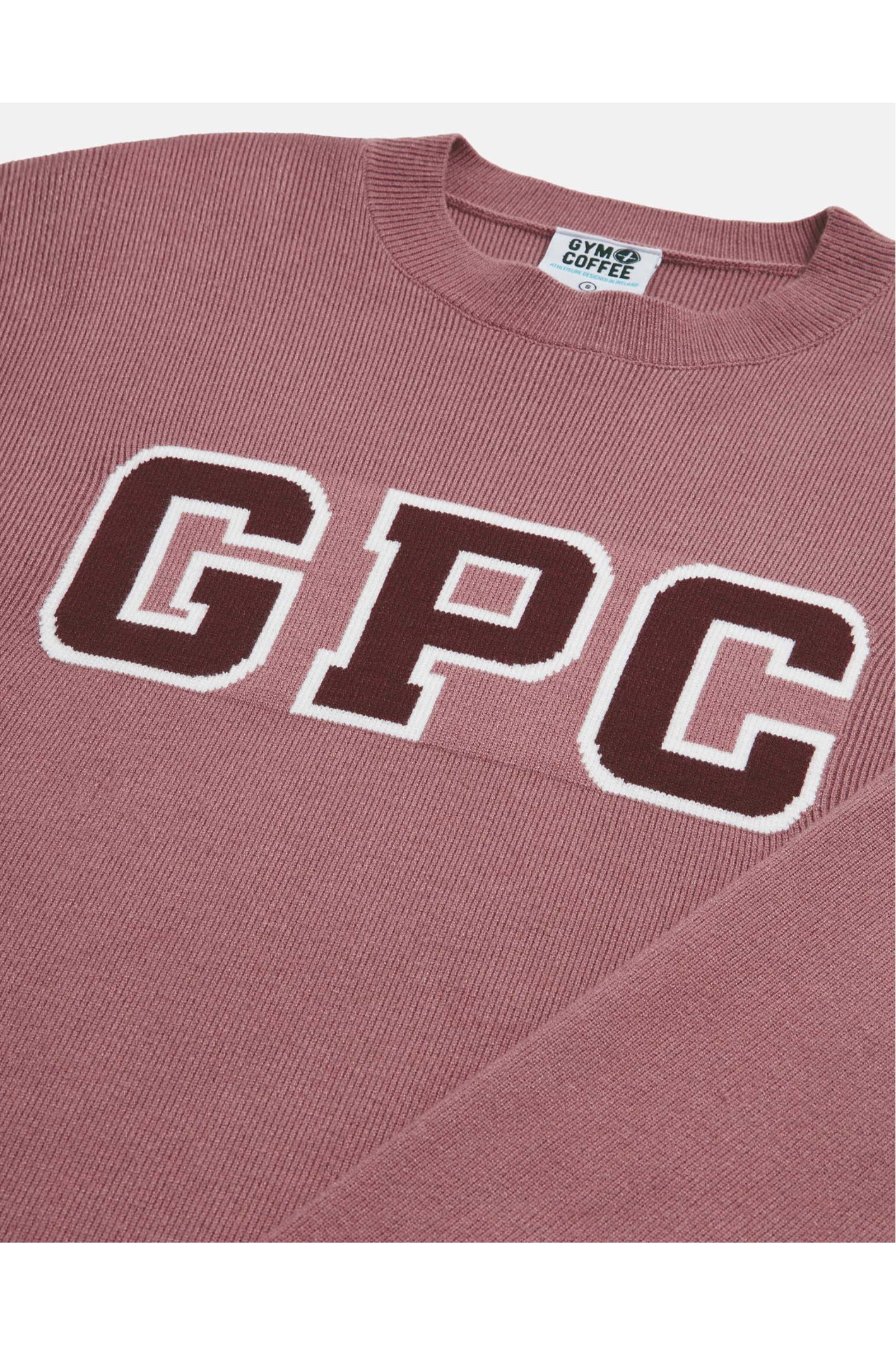 Close-up of Gym+Coffee Knit Crew in Terra Rose featuring GPC logo knit, shop Gym+Coffee at Dotique for soft activewear essentials