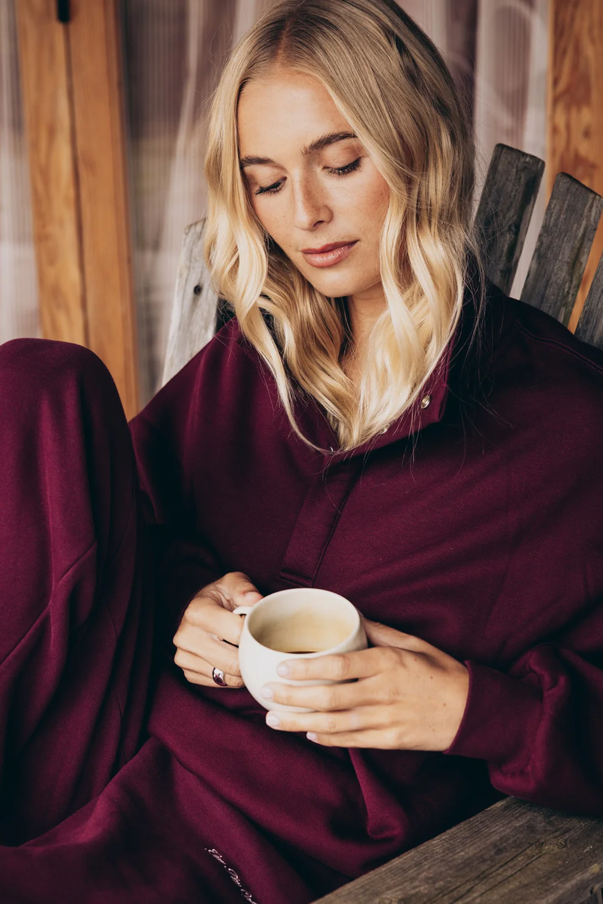 Gym+Coffee Knit Snap Collar Sierra Sweatshirt Cherry Crush by Gym+Coffee woman holding a mug Shop Gym+Coffee at Dotique
