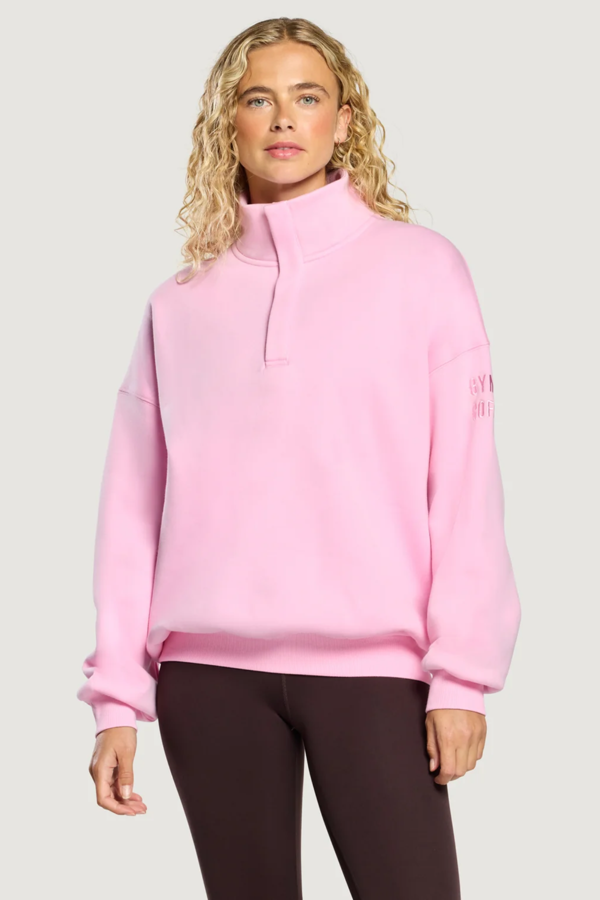 Gym+Coffee Knit Snap Collar Sierra Sweatshirt Pink Blossom on model. Shop Gym+Coffee at Dotique