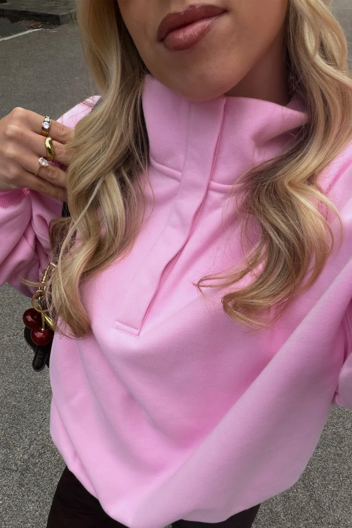 Gym+Coffee Knit Snap Collar Sierra Sweatshirt Pink Blossom worn by model. You can shop Gym+Coffee at Dotique.