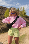 Gym+Coffee Roam Crossbody Bag Black worn outdoors. Shop Gym+Coffee at Dotique