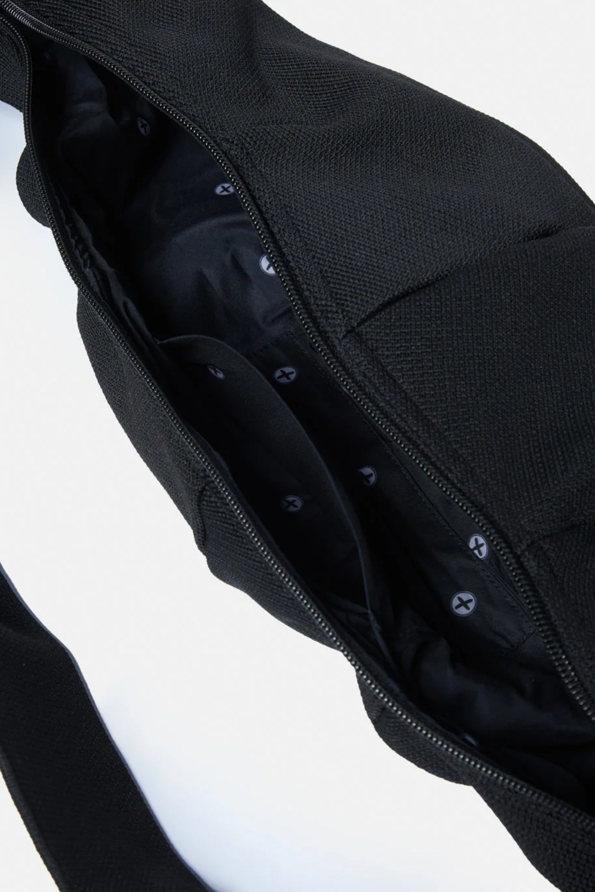 Gym+Coffee Roam Crossbody Bag Black open showing zippered interior. Gym+Coffee. You can Shop Gym+Coffee at Dotique.