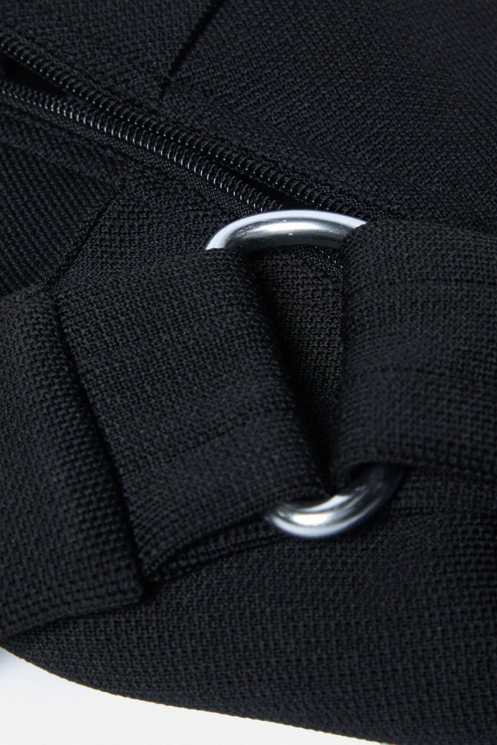 Gym+Coffee Roam Crossbody Bag Black by Gym+Coffee, black bag detail with silver rings. Shop Gym+Coffee at Dotique