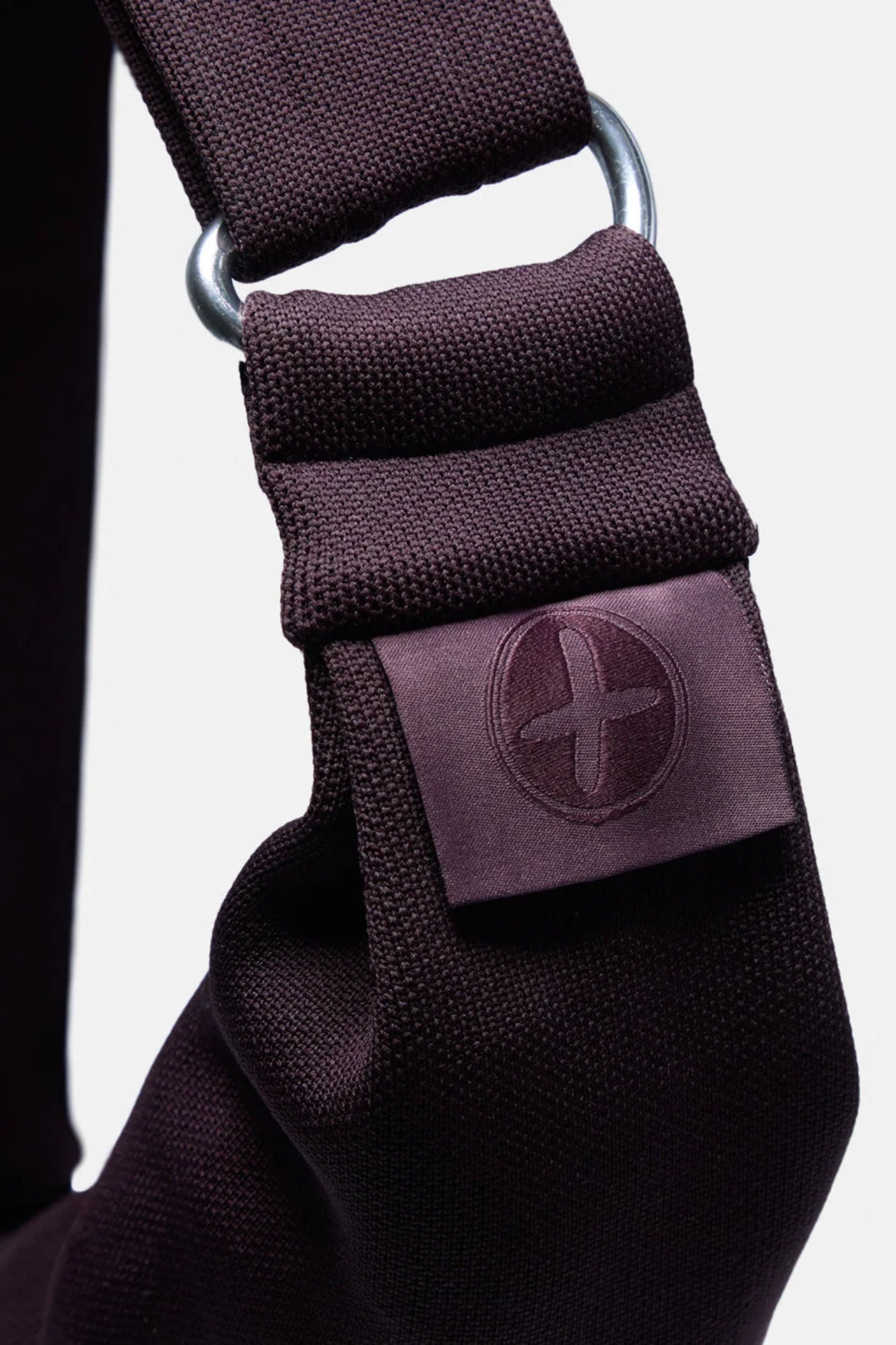 Gym+Coffee Roam Crossbody Bag Mocha Bean closeup with flap pocket and metal ring. Shop Gym+Coffee at Dotique