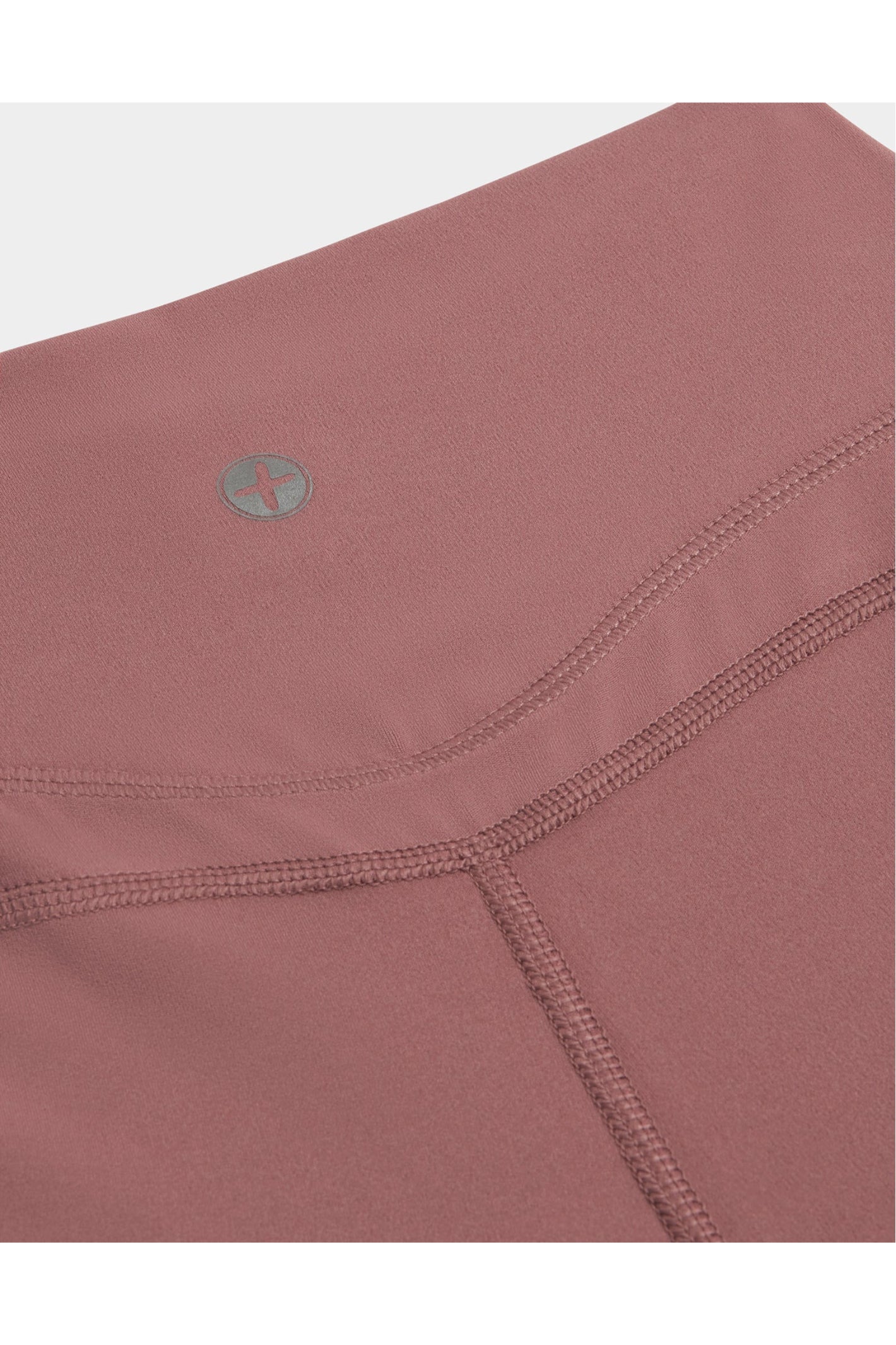 Close-up of stitching and fabric detail on Gym+Coffee Soft Motion Flares - Terra Rose, shop Gym+Coffee at Dotique for quality activewear
