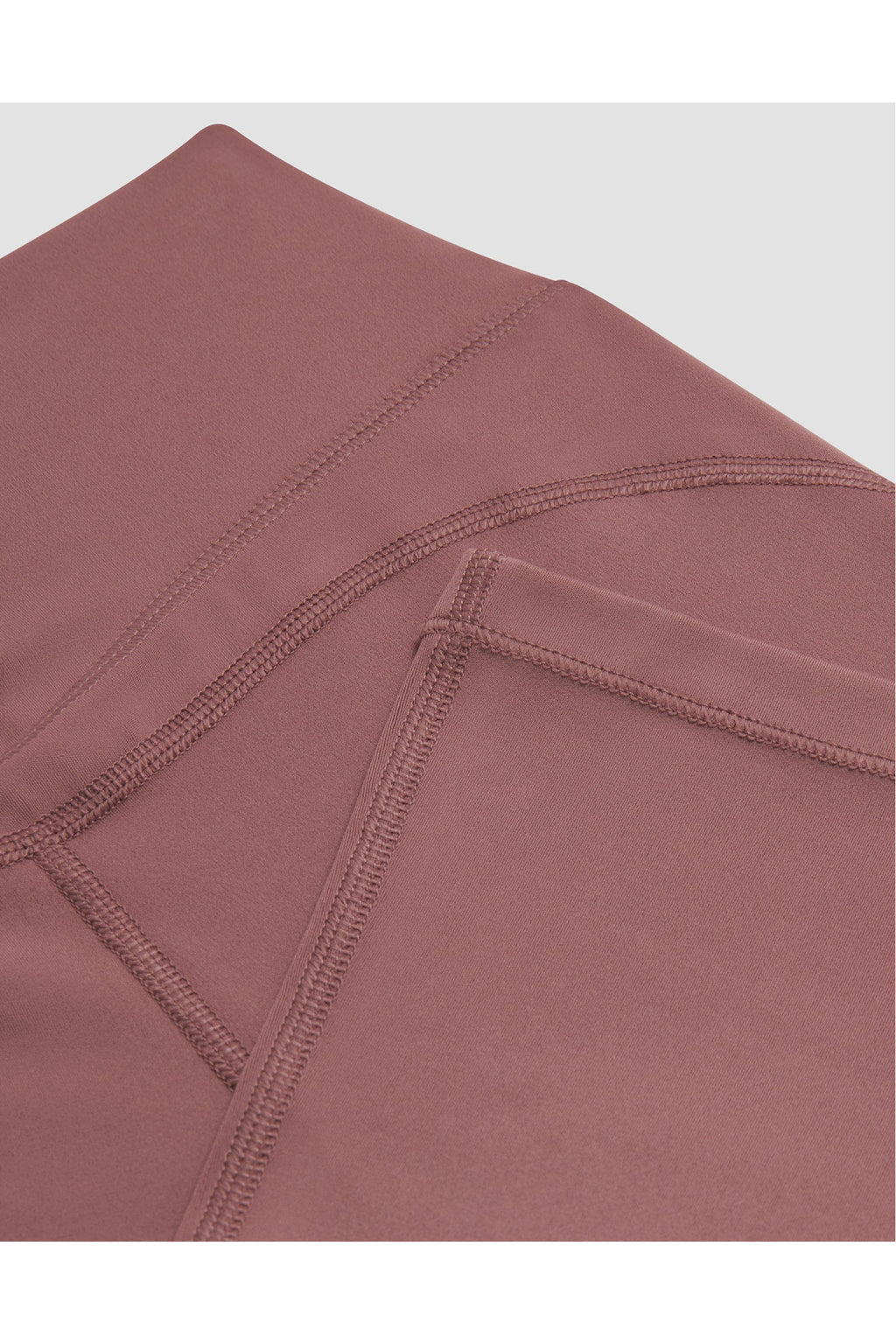 Close-up of stitching detail on Gym+Coffee Soft Motion Flares - Terra Rose, shop Gym+Coffee at Dotique for quality activewear