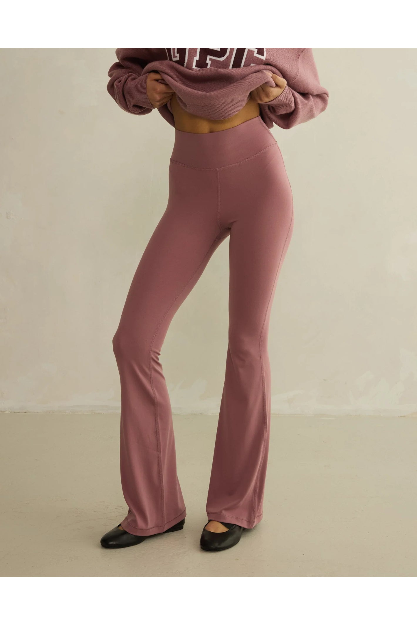 Gym+Coffee Soft Motion Flares - Terra Rose flared leggings on model, shop Gym+Coffee at Dotique for versatile activewear.