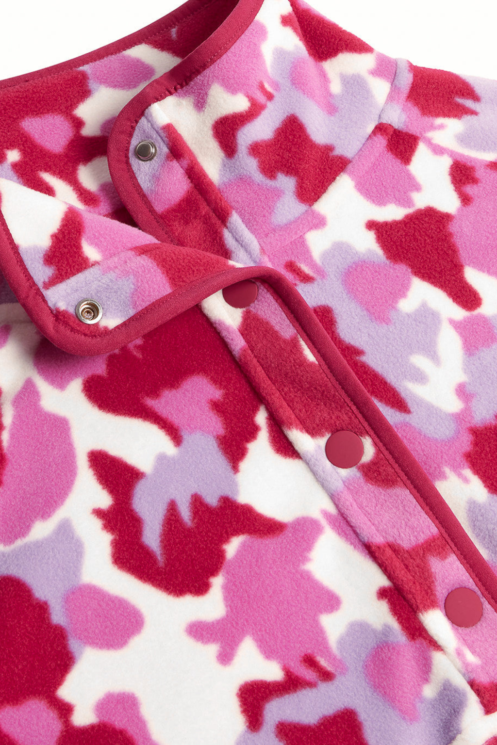Soft Pink Pop Print polar fleece from Gym+Coffee with snap-front and relaxed fit. Lightweight and cosy with zip pockets — a statement layer for everyday wear.