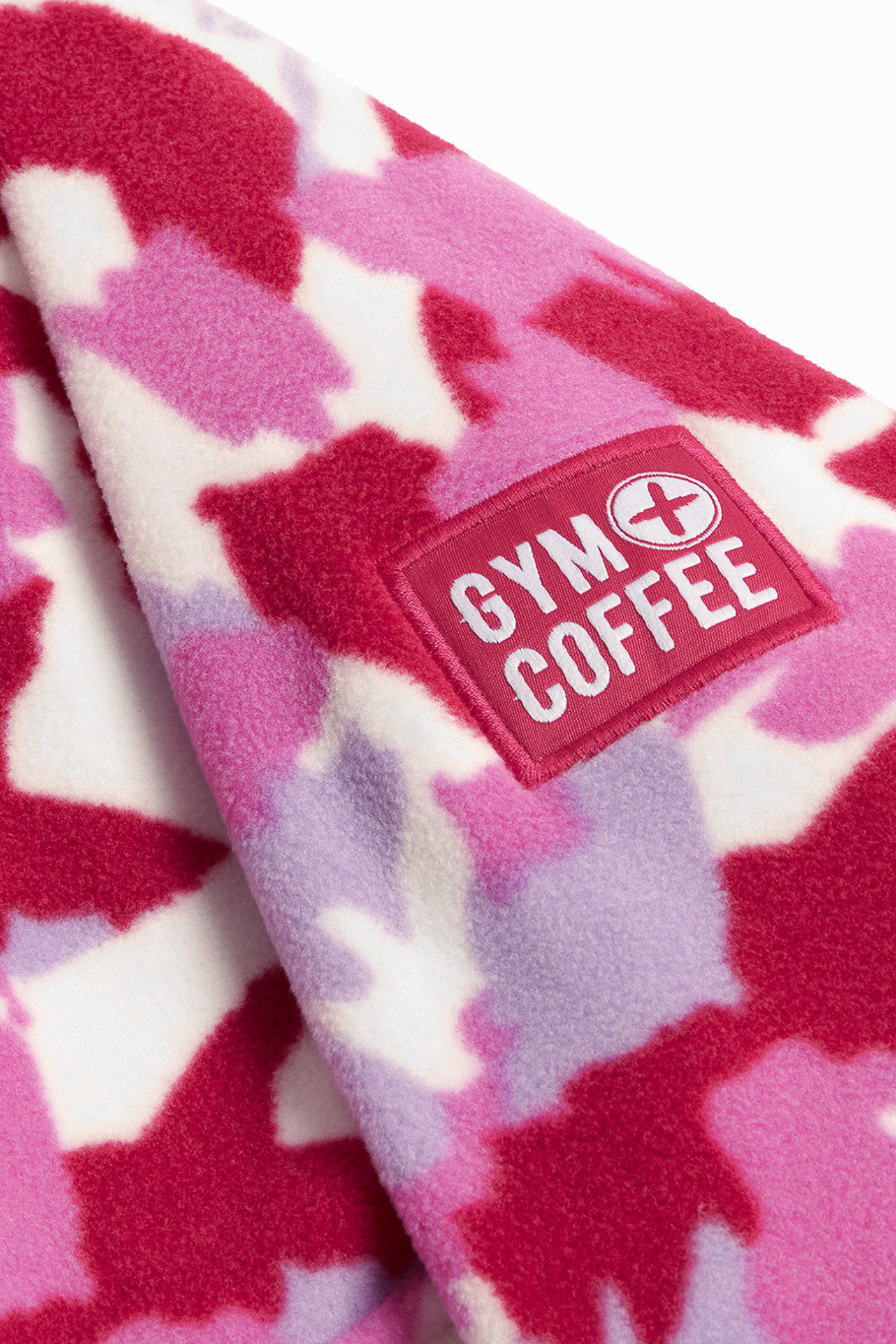 Soft Pink Pop Print polar fleece from Gym+Coffee with snap-front and relaxed fit. Lightweight and cosy with zip pockets — a statement layer for everyday wear.