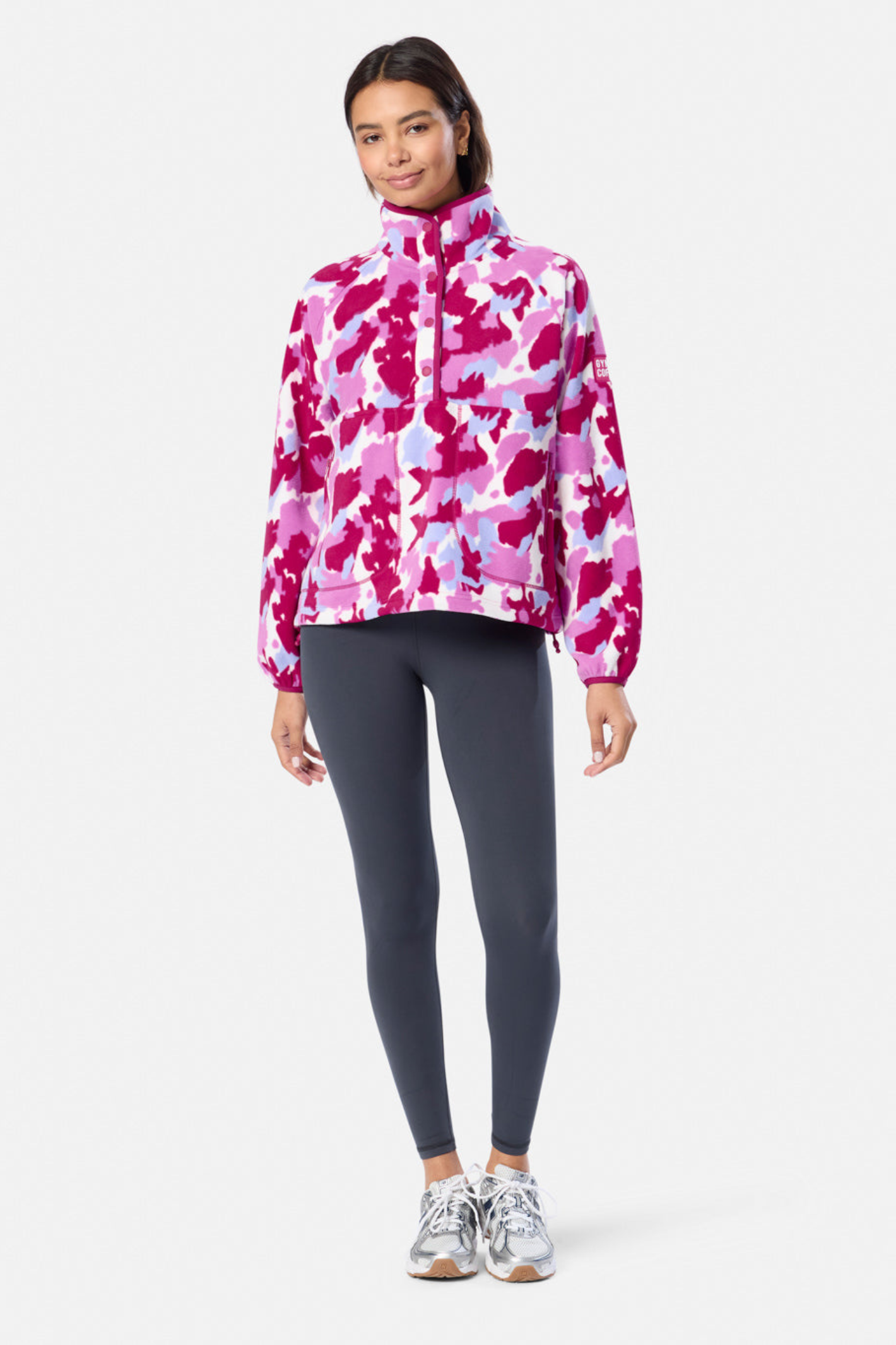 Soft Pink Pop Print polar fleece from Gym+Coffee with snap-front and relaxed fit. Lightweight and cosy with zip pockets — a statement layer for everyday wear.