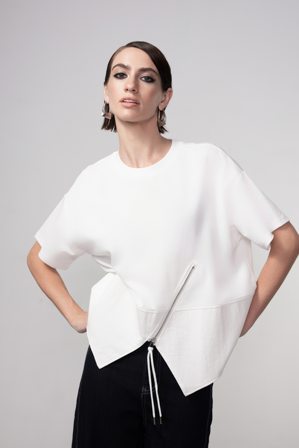 Haako white cotton zip detail top styled in a clean minimalist outfit at Dotique