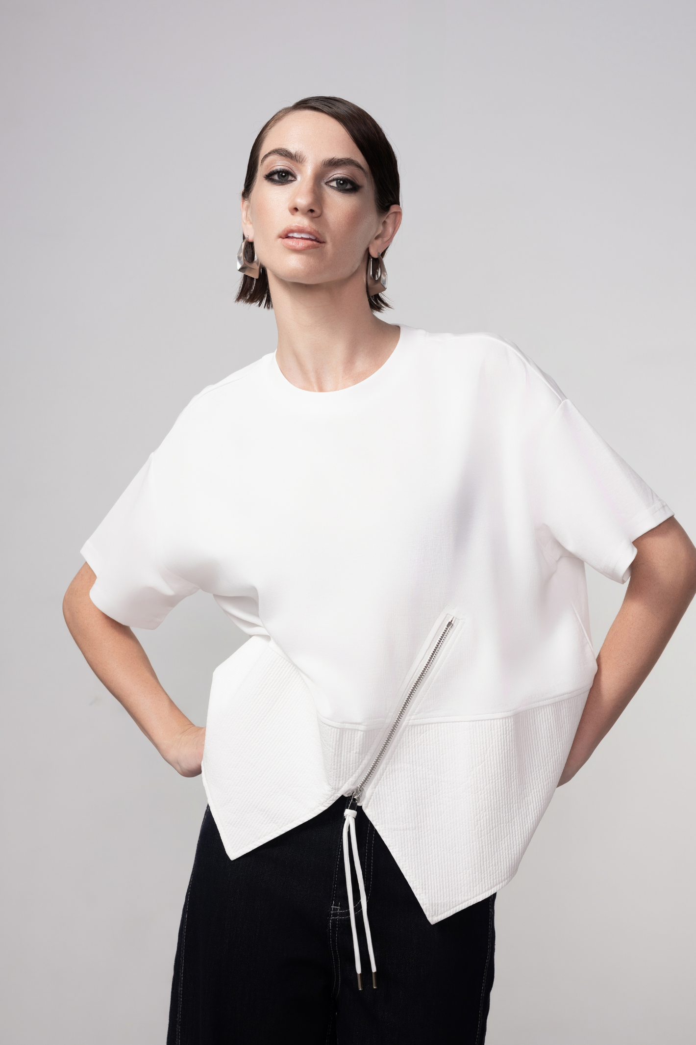 Haako white cotton zip detail top styled in a clean minimalist outfit at Dotique