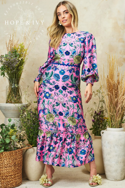 Romantic pink maxi dress by Hope & Ivy with high neck, blouson sleeves and bow back detail. Shop Hope & Ivy Dresses at Dotique.