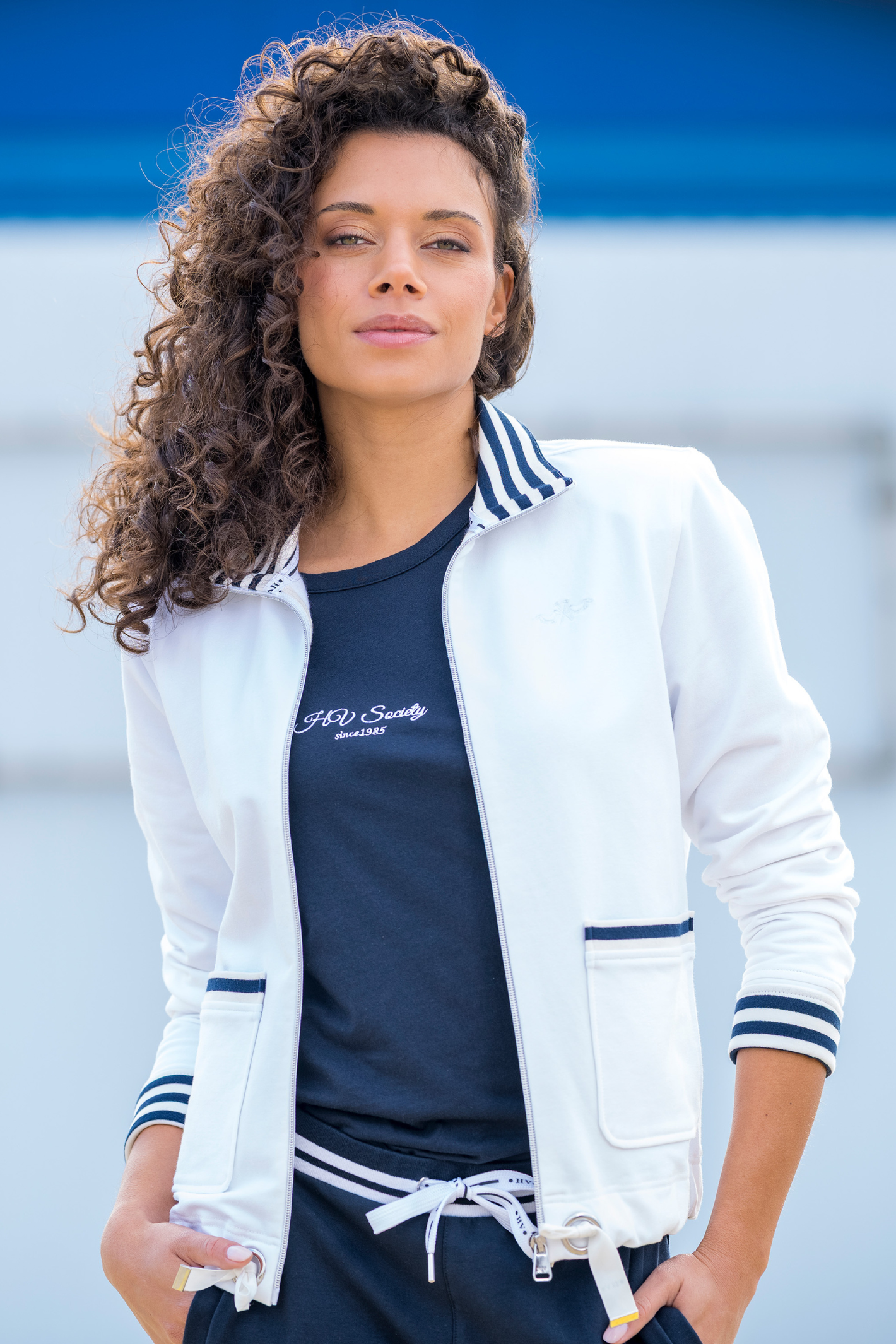 Model wearing HV Society HVSLauren White Cardigan with striped collar and pockets by HV Society shop at Dotique