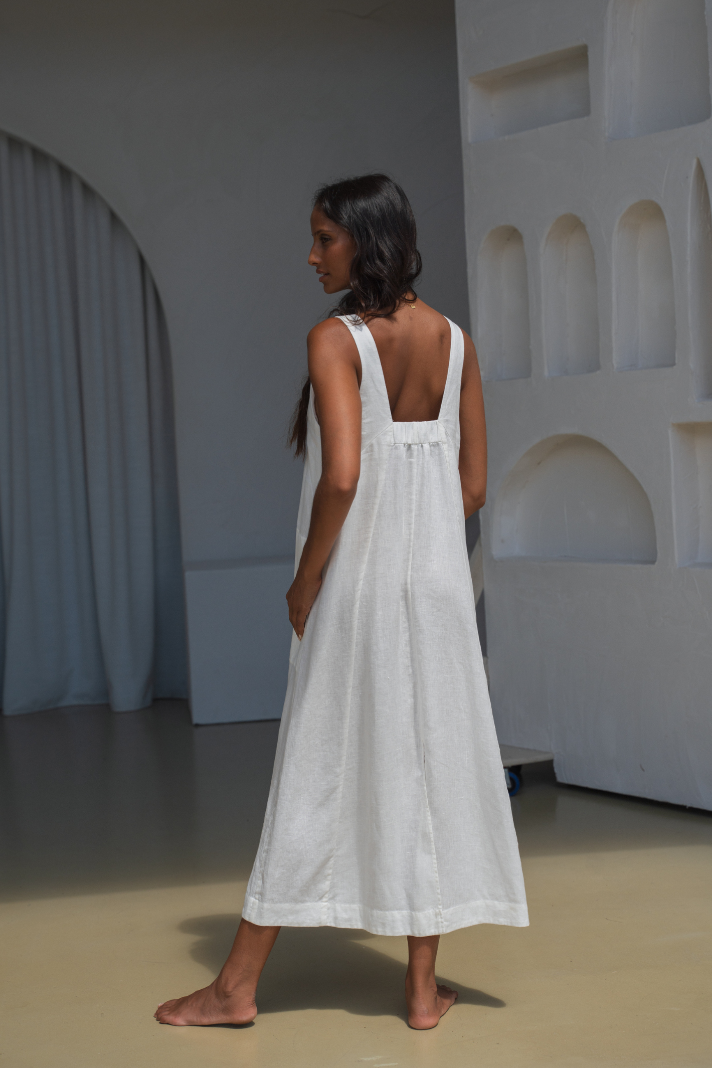 Woman wearing Lilly Pilly LP-D018 Iris Linen Dress Ivory by Lilly Pilly, shop Lilly Pilly at Dotique online store.