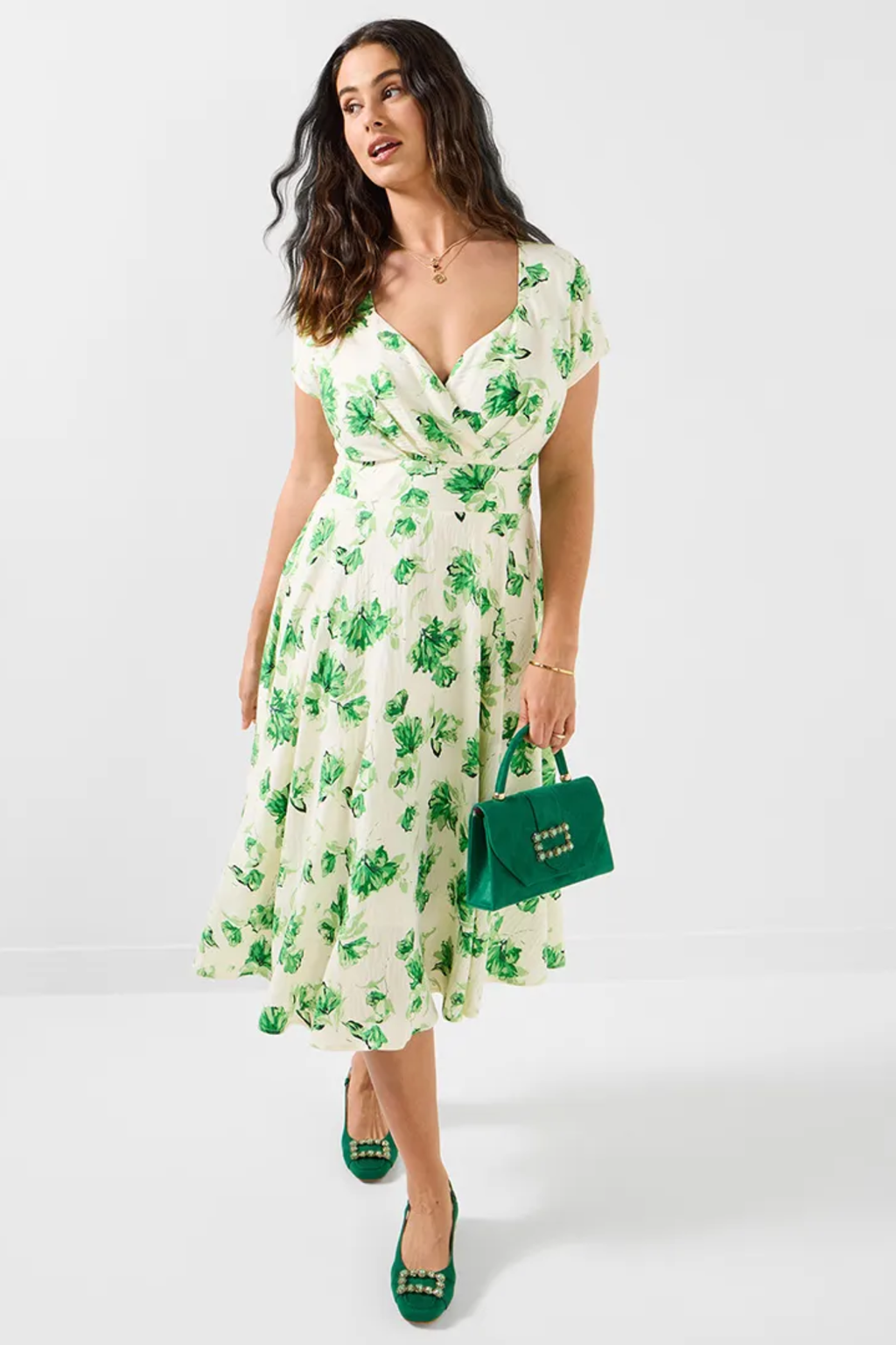 Woman wearing Joe Browns WF416A Day At The Races Floral Dress Green by Joe Browns, shop Joe Browns at Dotique for stylish floral elegance