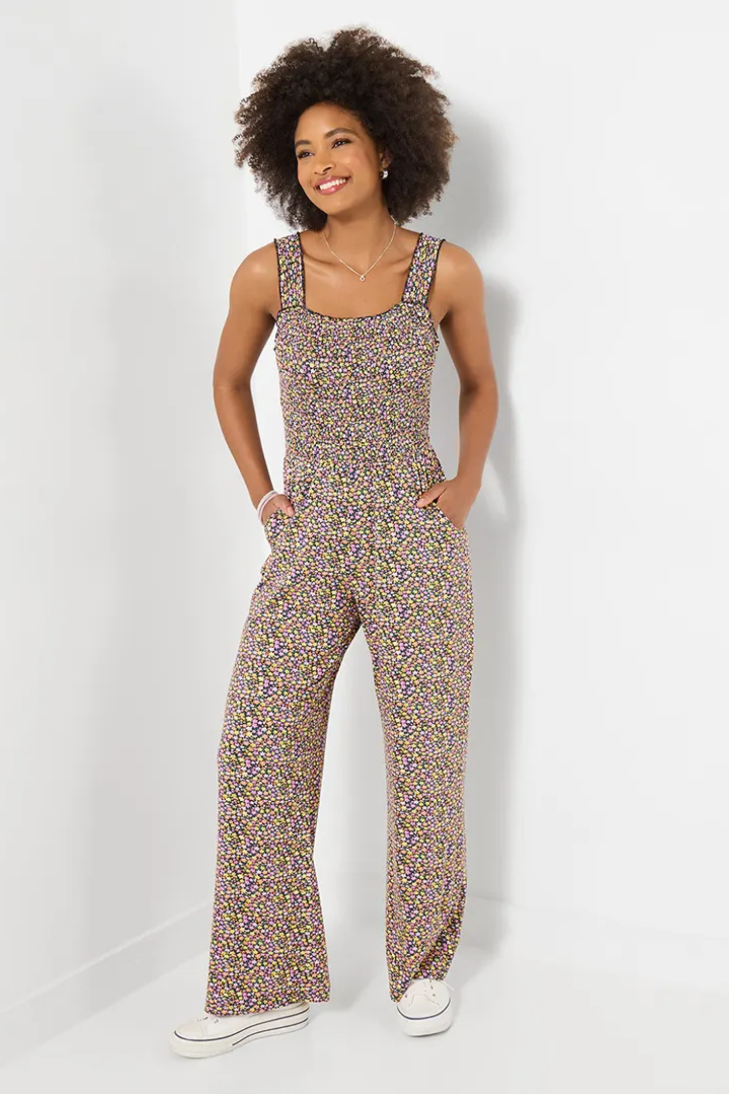 Woman wearing Joe Browns WM017A Summer Days Jersey Jumpsuit Black with a floral pattern by Joe Browns, shop Joe Browns at Dotique.