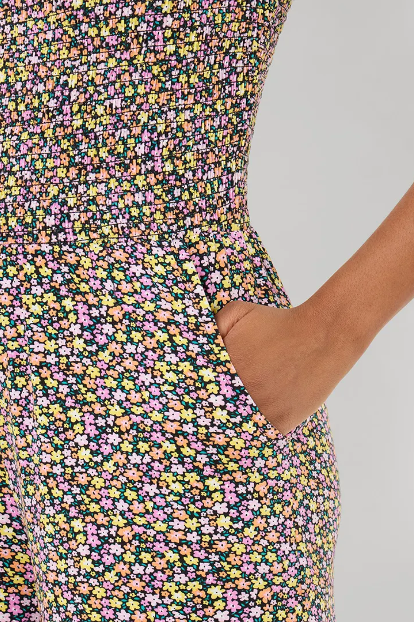 Close-up of floral print detail and pocket on Joe Browns WM017A Summer Days Jersey Jumpsuit Black by Joe Browns, shop Joe Browns at Dotique.