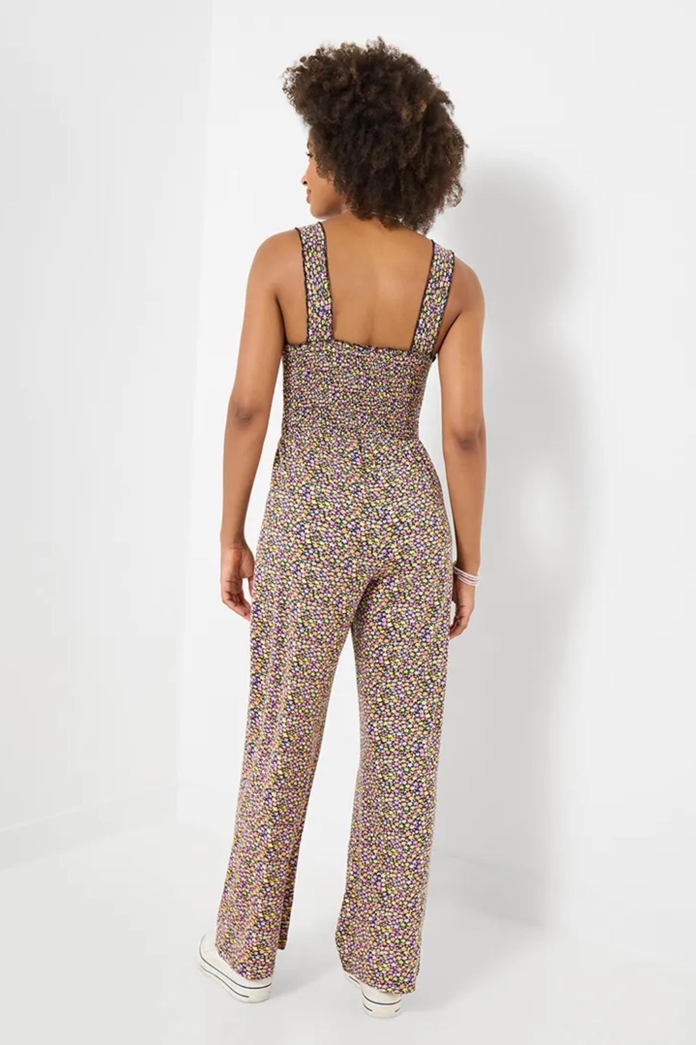 Woman seen from behind wearing Joe Browns WM017A Summer Days Jersey Jumpsuit Black with floral pattern by Joe Browns, shop Joe Browns at Dotique.