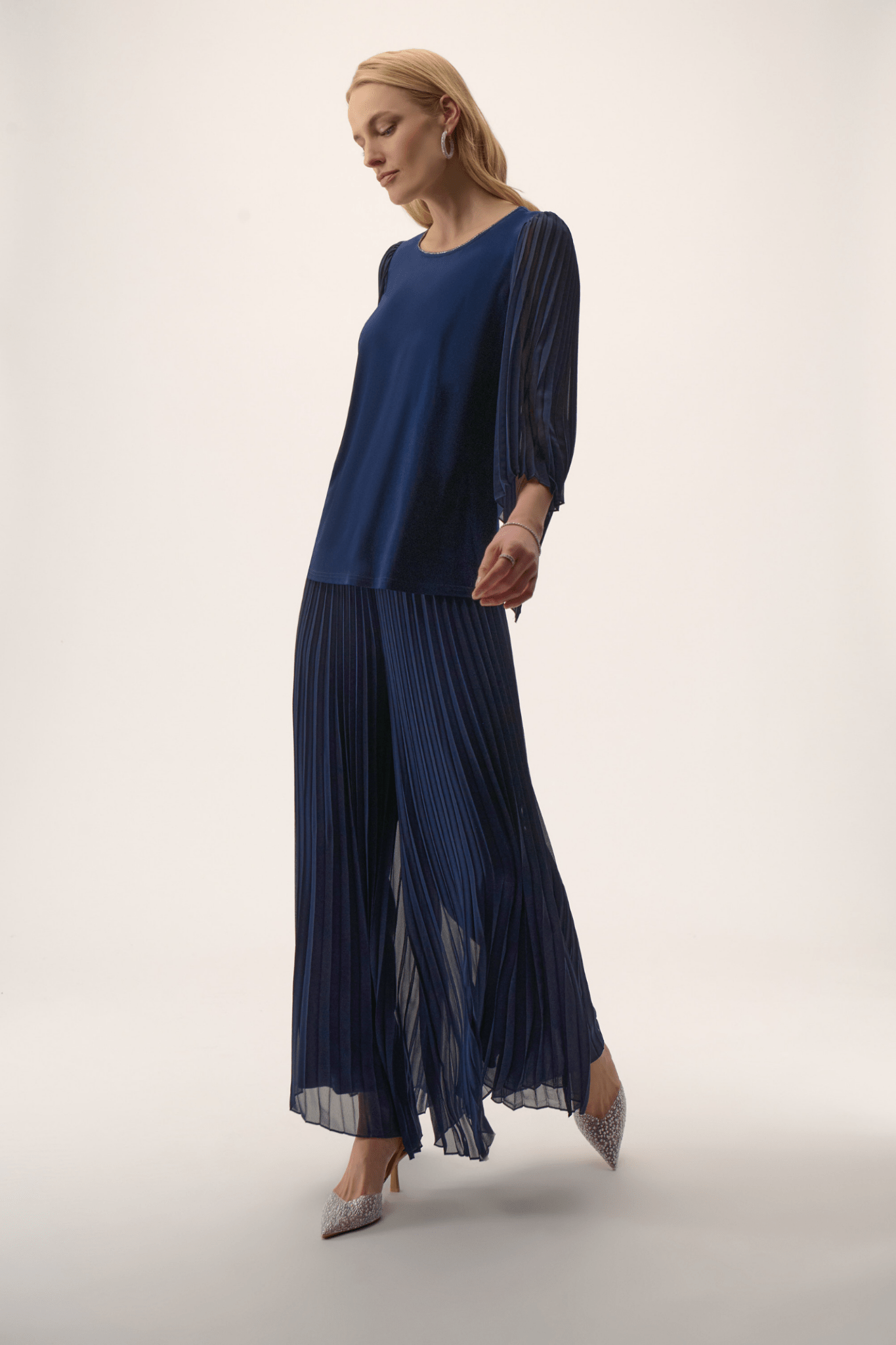 Joseph Ribkoff silky knit top in midnight blue with rhinestone neckline and pleated chiffon bell sleeves