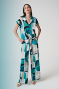 Statement wide leg trousers by Joseph Ribkoff in textured satin with a bold geometric print. Easy pull-on fit with pockets. Shop now at Dotique.