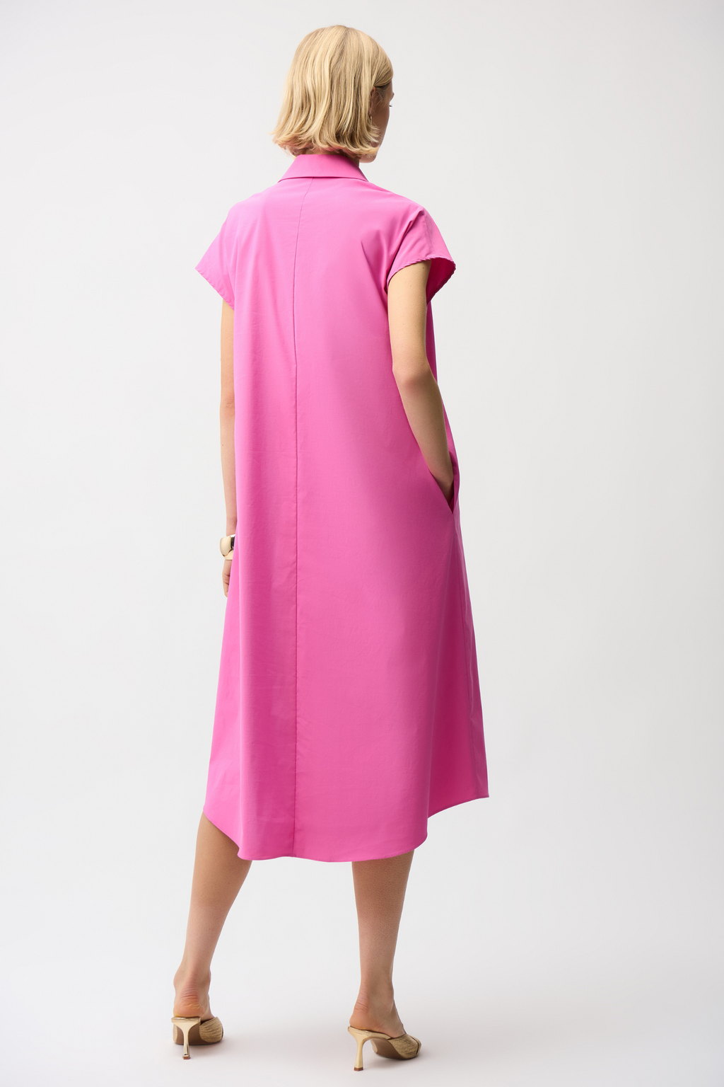 Joseph Ribkoff 261049 pink trapeze shirt dress in stretch poplin. Easy fit with collar, pockets and short sleeves. Shop at Dotique.