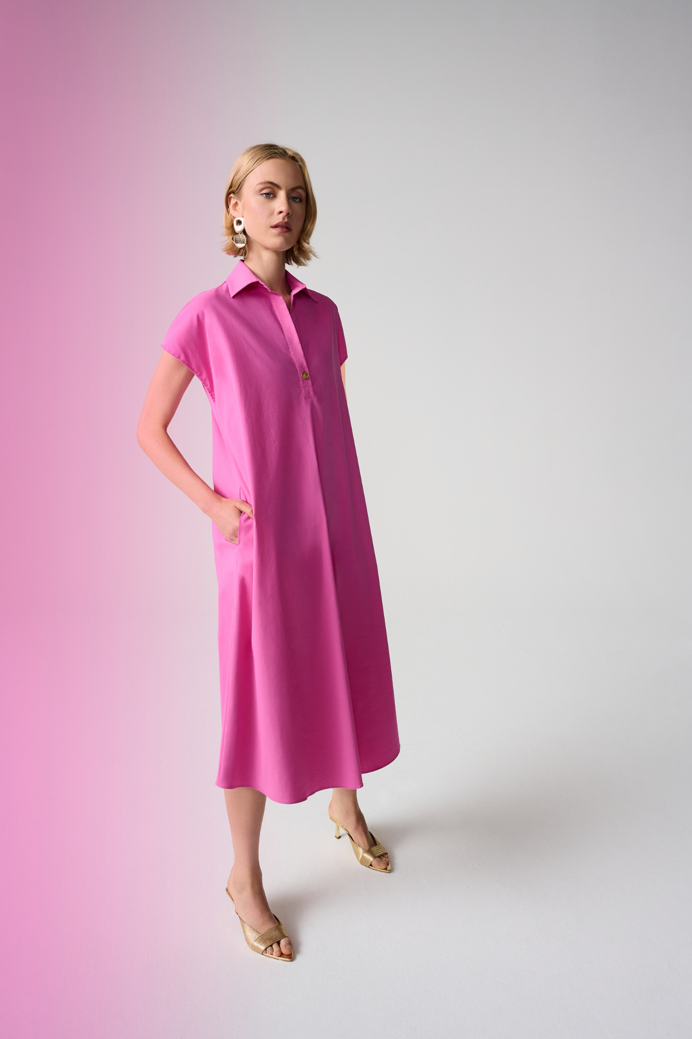 Joseph Ribkoff 261049 pink trapeze shirt dress in stretch poplin. Easy fit with collar, pockets and short sleeves. Shop at Dotique.