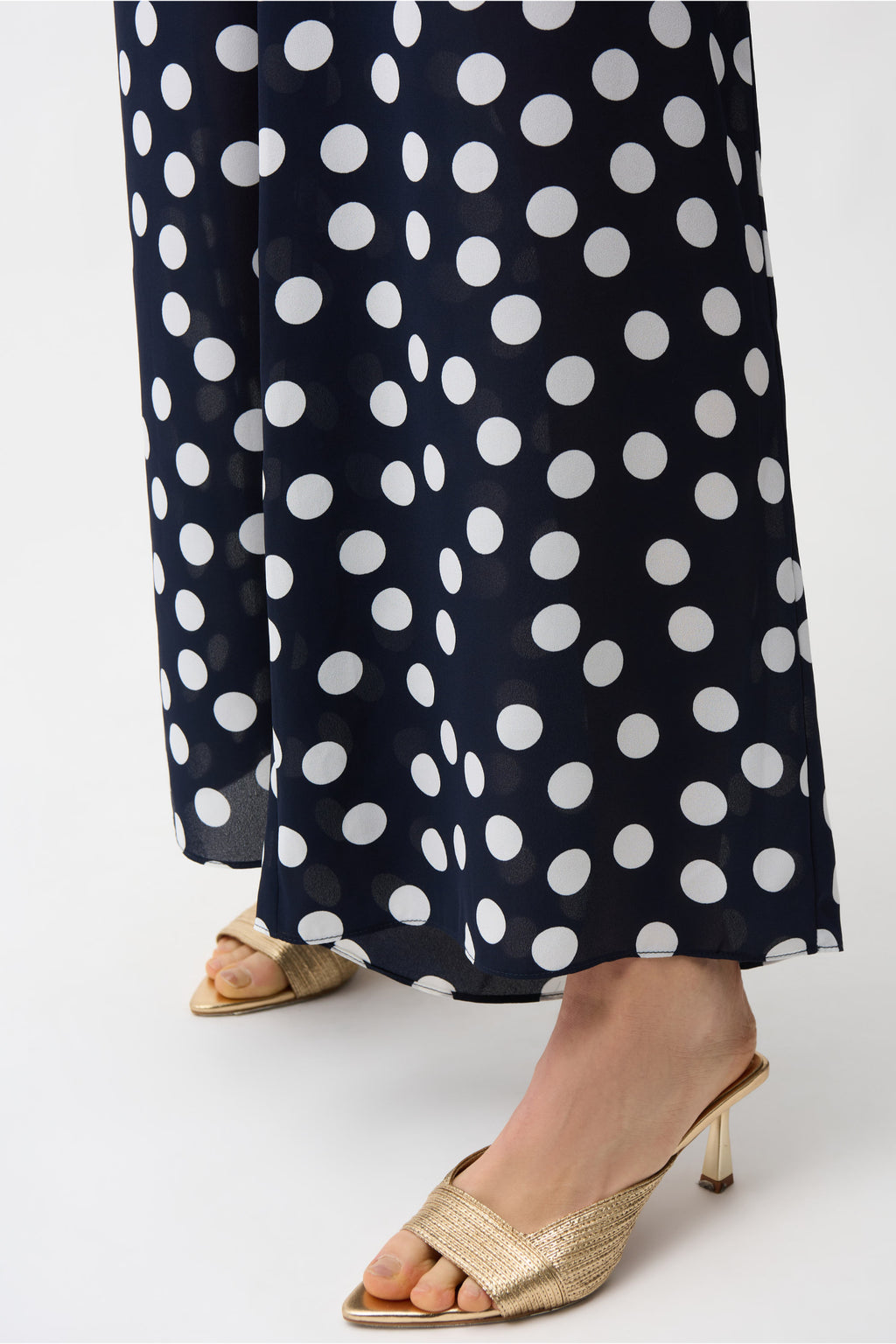 Close-up of legs wearing Joseph Ribkoff 261305 Georgette Polka Dot Wide Leg Trousers Midnight Blue by Joseph Ribkoff, shop Joseph Ribkoff at Dotique