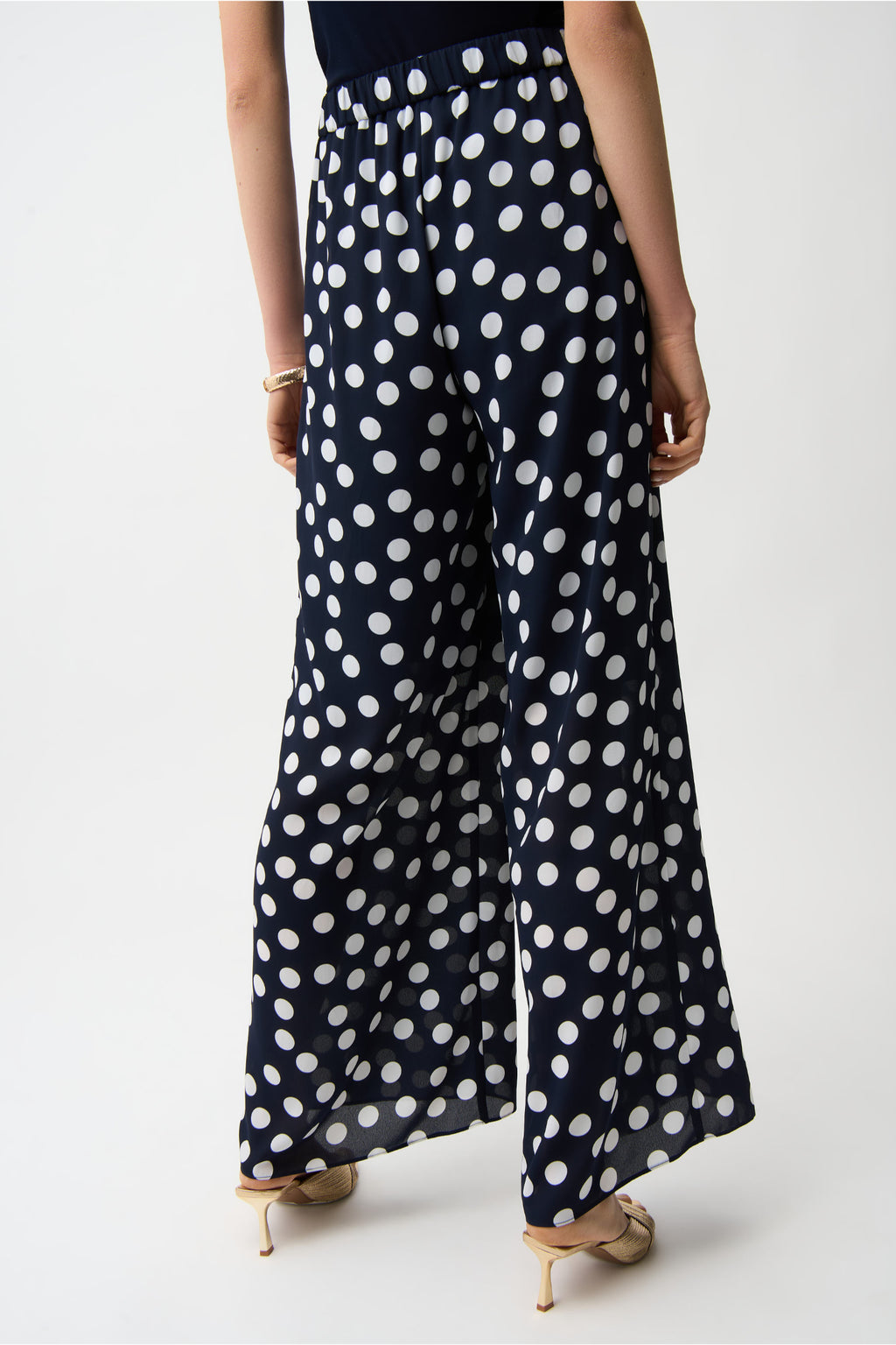 Back view of model wearing Joseph Ribkoff 261305 Georgette Polka Dot Wide Leg Trousers Midnight Blue by Joseph Ribkoff, shop Joseph Ribkoff at Dotique