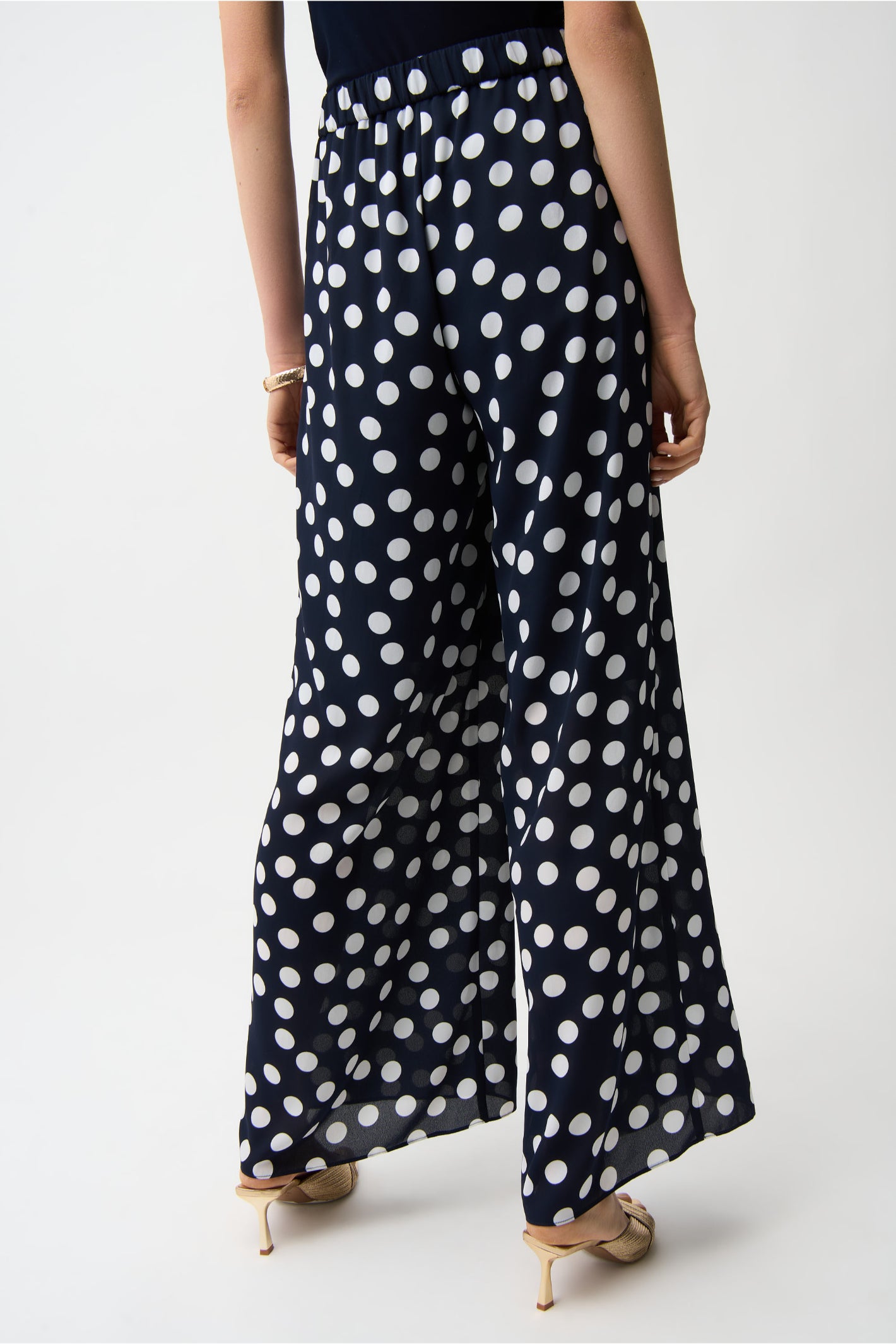 Back view of model wearing Joseph Ribkoff 261305 Georgette Polka Dot Wide Leg Trousers Midnight Blue by Joseph Ribkoff, shop Joseph Ribkoff at Dotique