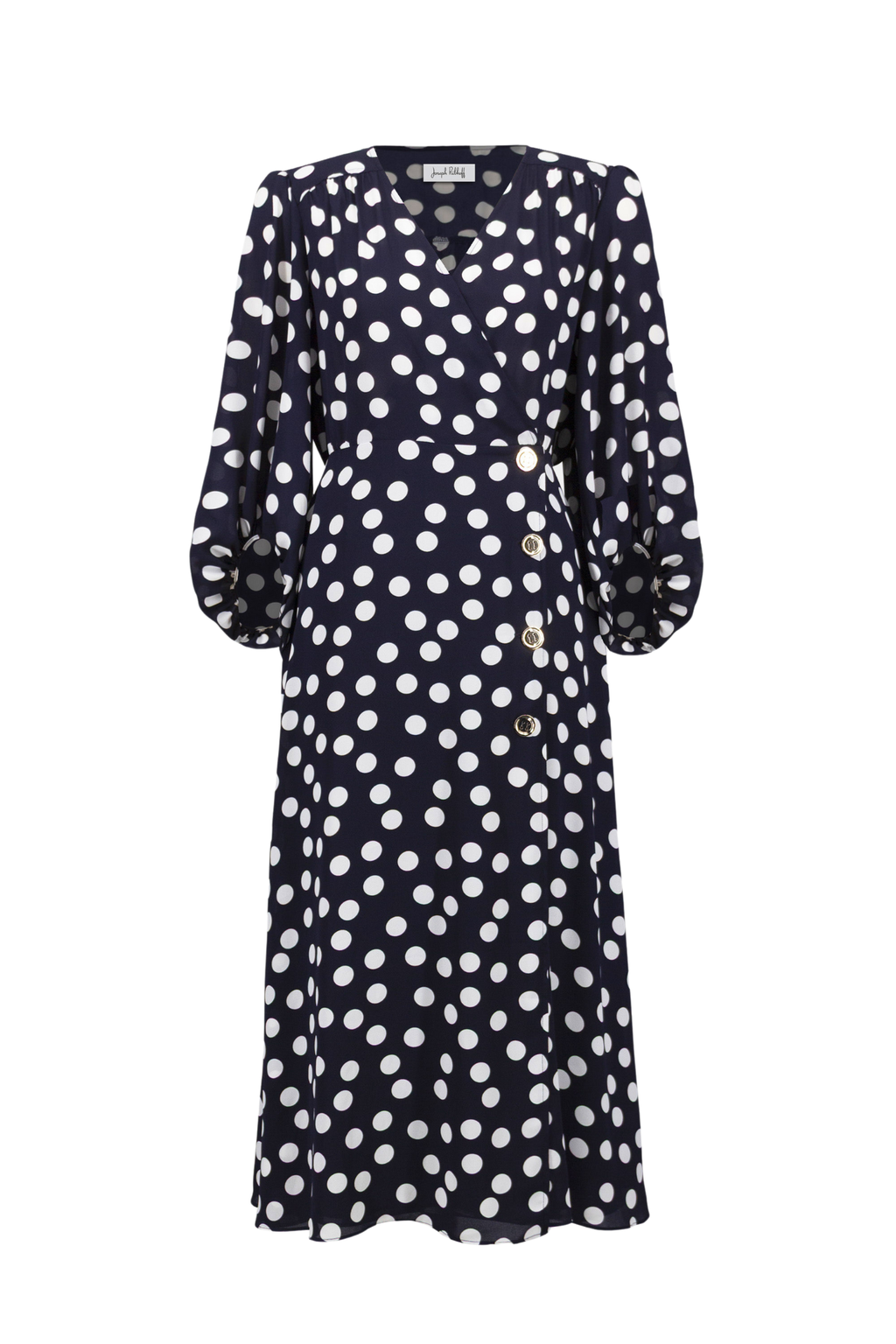 Joseph Ribkoff 261901 georgette polka dot wrap dress with puff sleeves and midi skirt. Flattering, elegant and easy to wear. Shop Dotique.