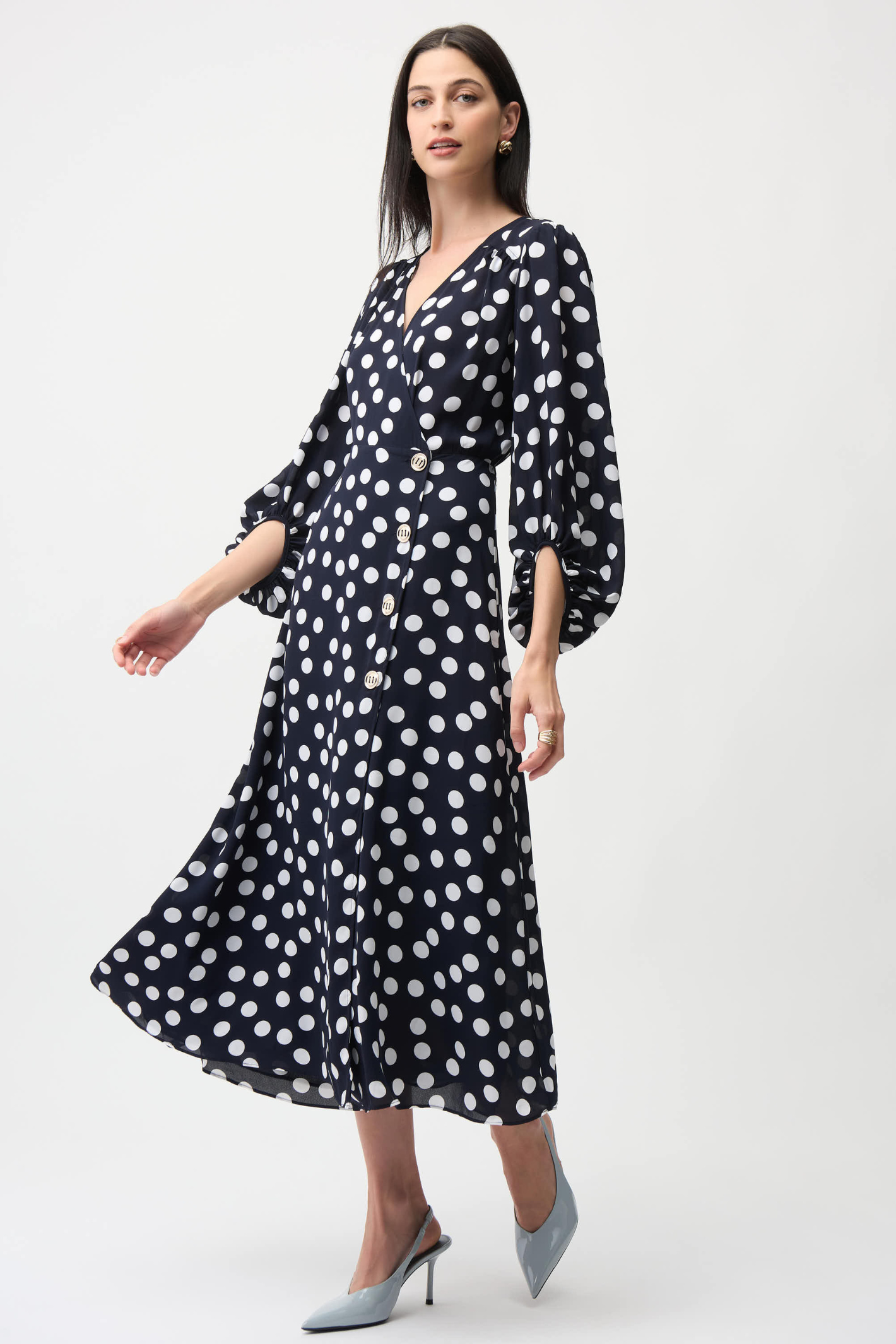 Joseph Ribkoff 261901 georgette polka dot wrap dress with puff sleeves and midi skirt. Flattering, elegant and easy to wear. Shop Dotique.