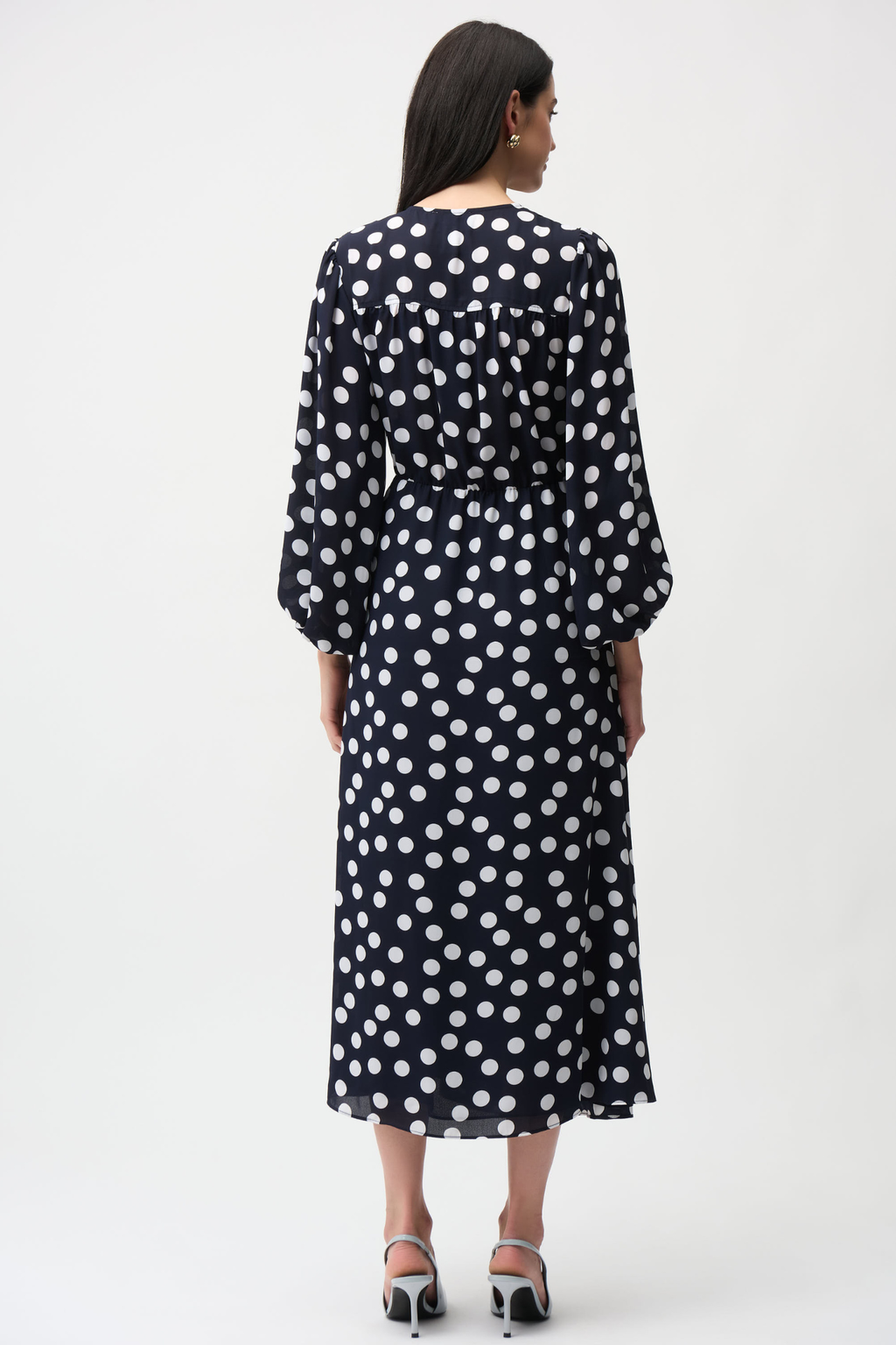 Joseph Ribkoff 261901 georgette polka dot wrap dress with puff sleeves and midi skirt. Flattering, elegant and easy to wear. Shop Dotique.