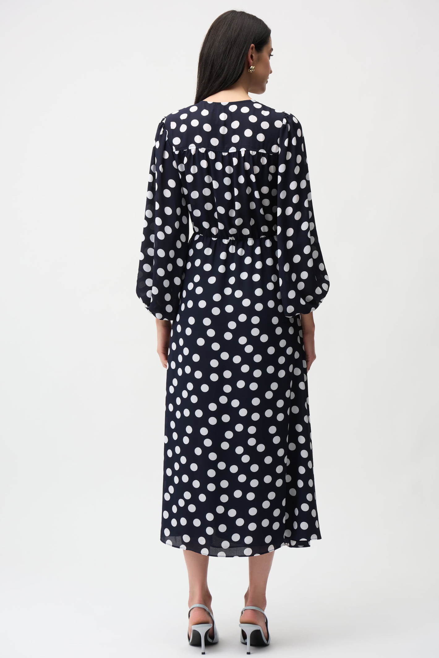 Joseph Ribkoff 261901 georgette polka dot wrap dress with puff sleeves and midi skirt. Flattering, elegant and easy to wear. Shop Dotique.