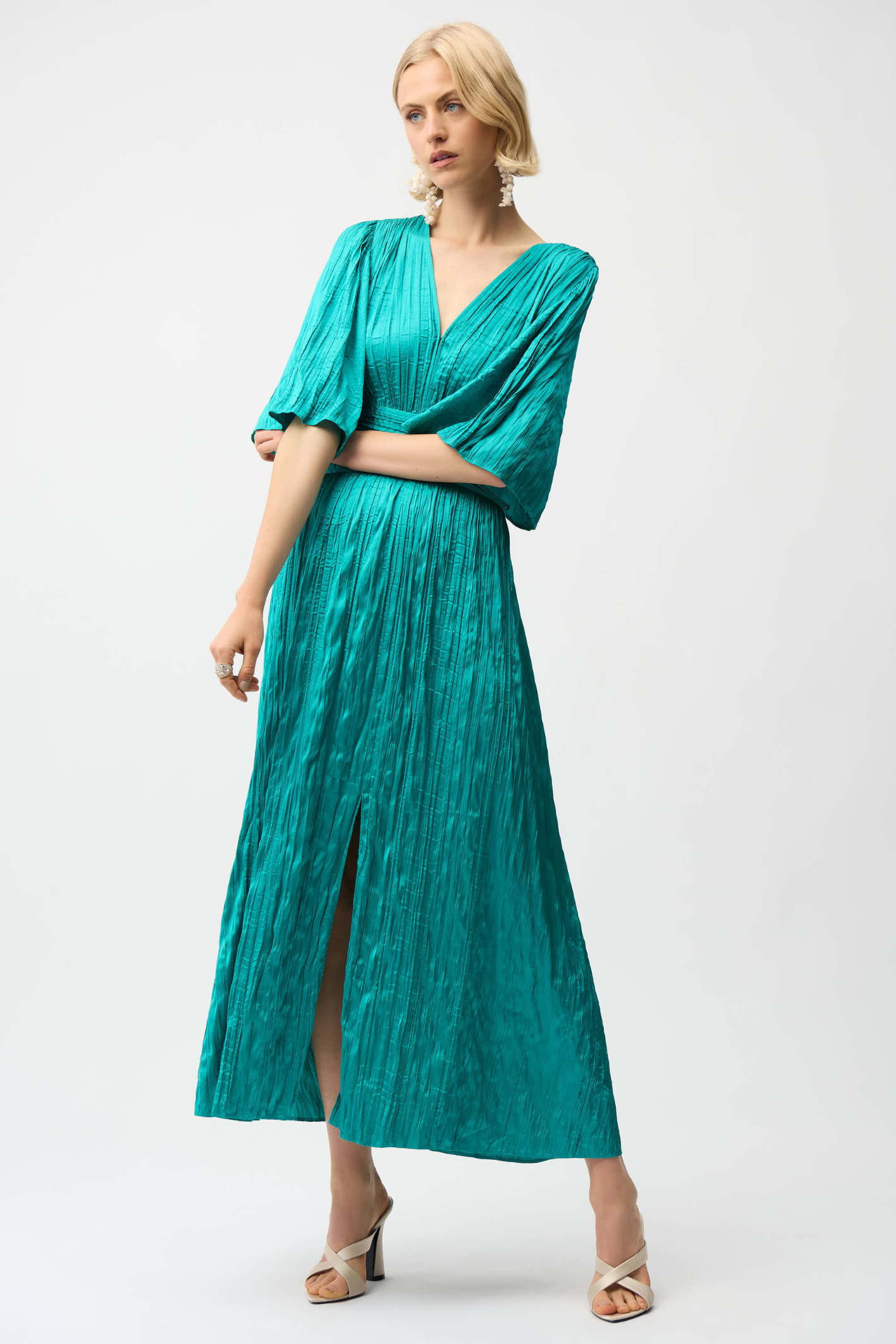Joseph Ribkoff 261962 satin fit and flare midi dress with pleated knot waist and flare sleeves. Elegant, flattering and perfect for occasions. Shop Dotique.