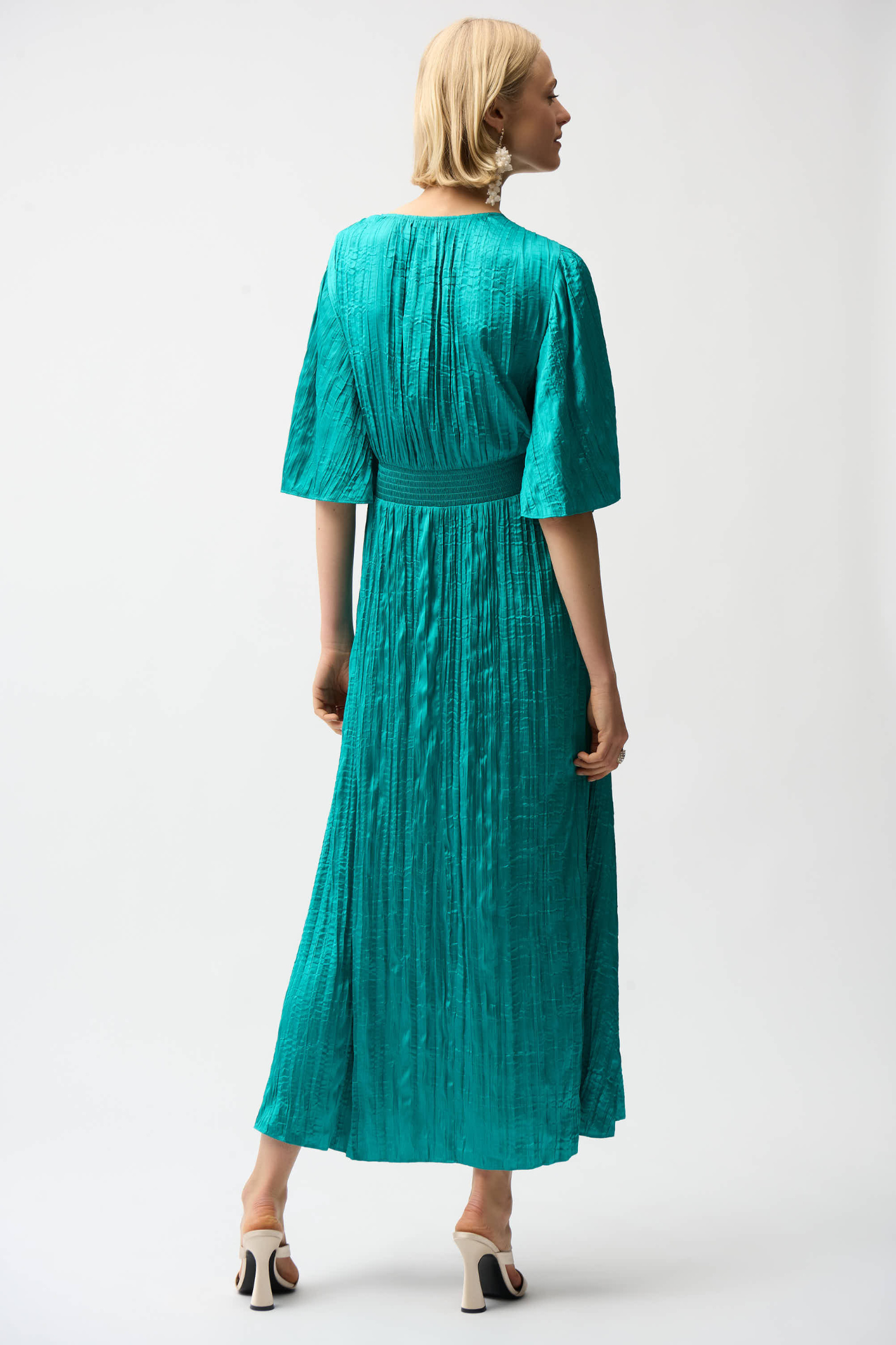 Joseph Ribkoff 261962 satin fit and flare midi dress with pleated knot waist and flare sleeves. Elegant, flattering and perfect for occasions. Shop Dotique.