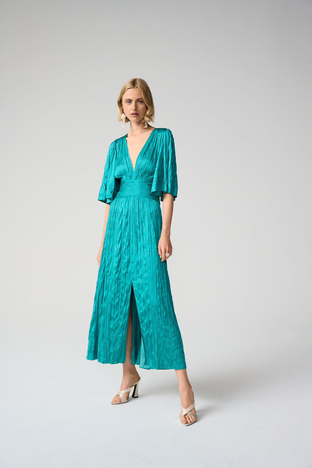 Joseph Ribkoff 261962 satin fit and flare midi dress with pleated knot waist and flare sleeves. Elegant, flattering and perfect for occasions. Shop Dotique.