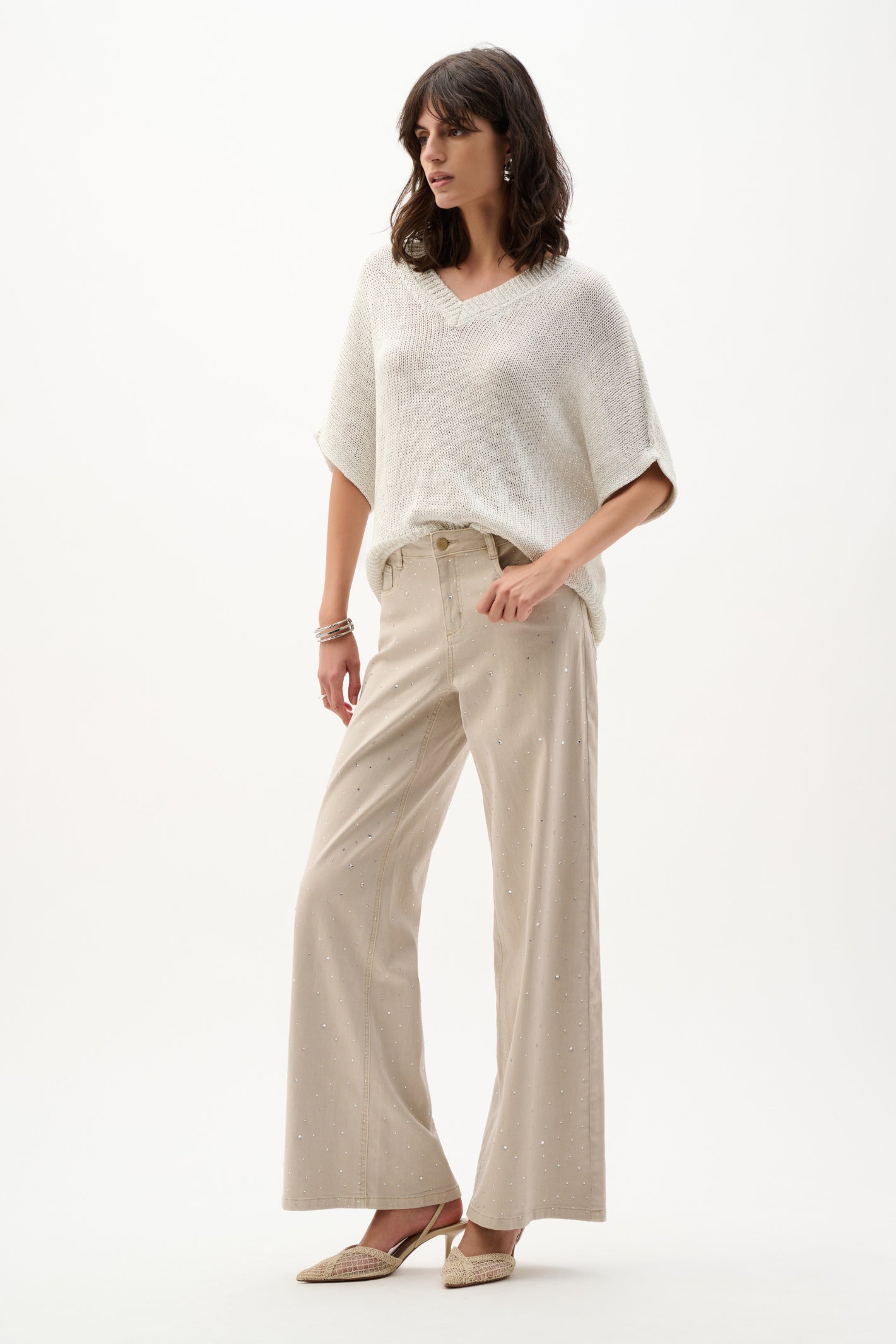 Model wearing Joseph Ribkoff 262925 Viscose & Lurex Relaxed Knit Top Vanilla by Joseph Ribkoff, shop Joseph Ribkoff at Dotique
