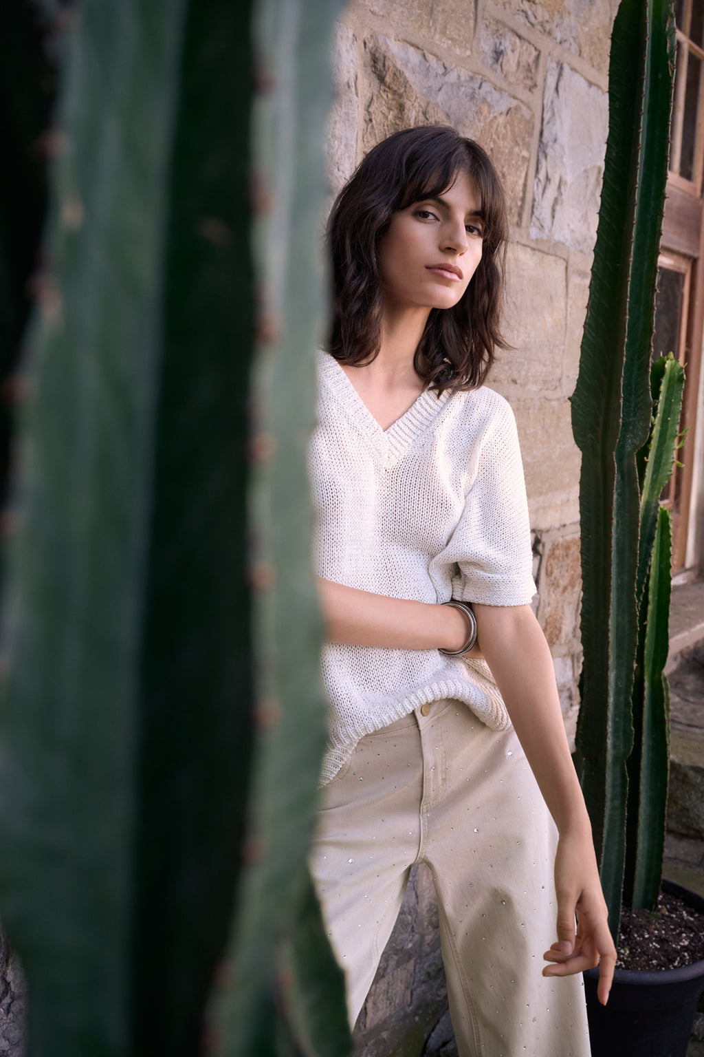 Model wearing Joseph Ribkoff 262925 Viscose & Lurex Relaxed Knit Top Vanilla by Joseph Ribkoff Shop Dotique