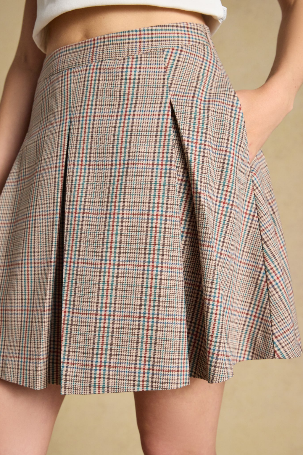 Shop the Joules Ada Short Pleated Skirt in Swindale Tweed. A heritage check mini with structured pleats, tailored waist and concealed side zip.