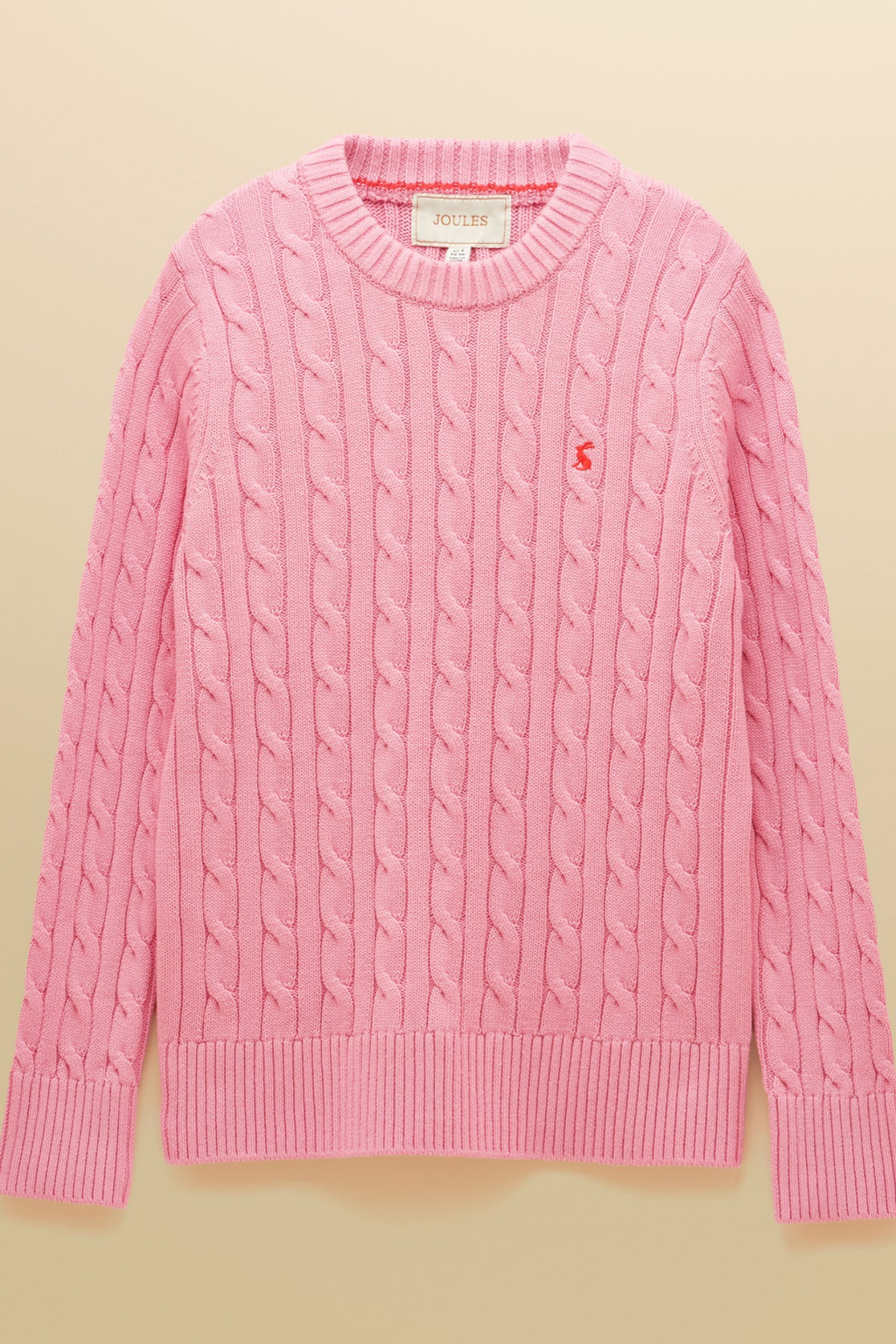 Shop the Joules Classic Cable Jumper in Pink at Dotique. A 100% cotton cable knit with a crew neck, ribbed trims and signature Joules hare embroidery.