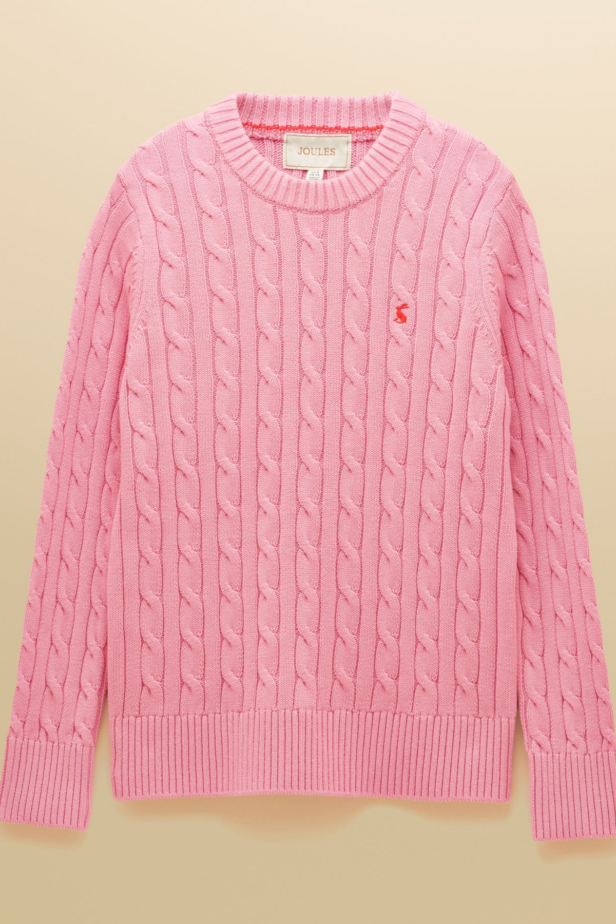 Shop the Joules Classic Cable Jumper in Pink at Dotique. A 100% cotton cable knit with a crew neck, ribbed trims and signature Joules hare embroidery.