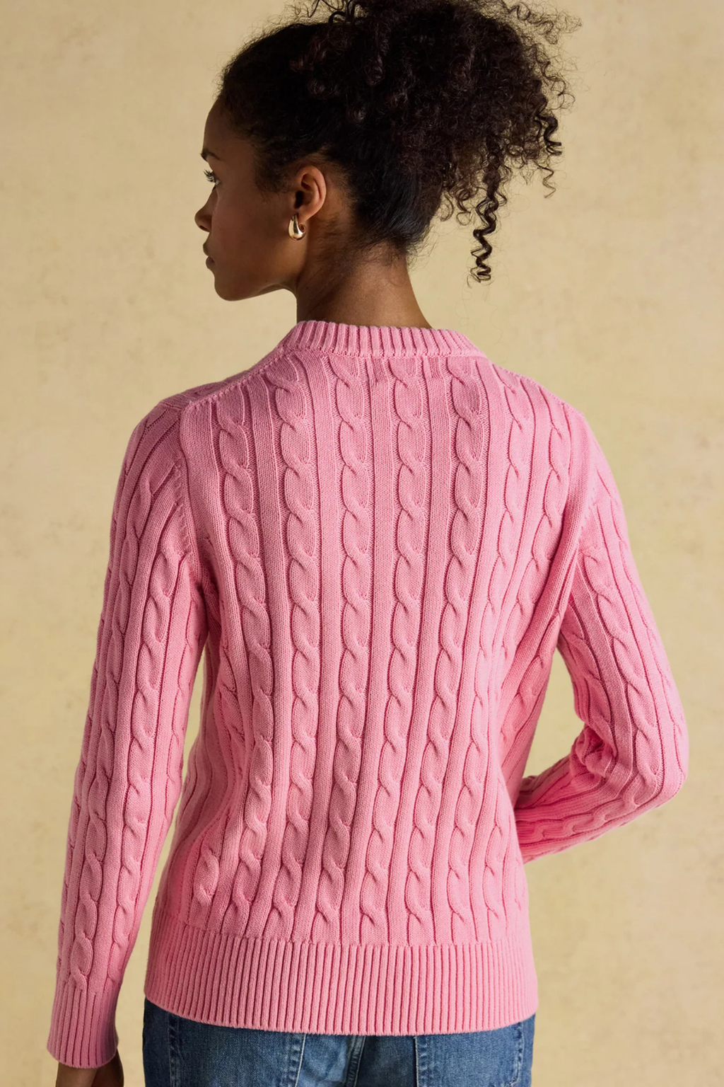 Shop the Joules Classic Cable Jumper in Pink at Dotique. A 100% cotton cable knit with a crew neck, ribbed trims and signature Joules hare embroidery.