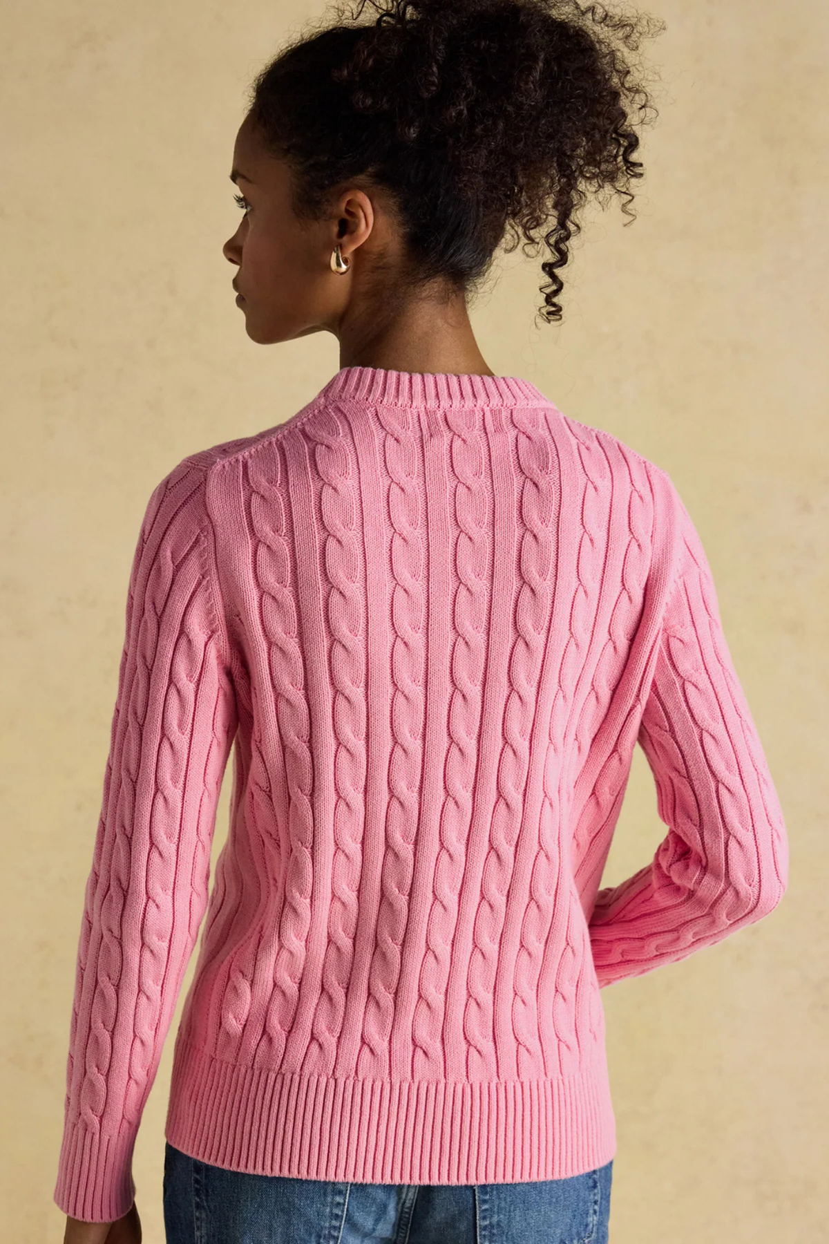 Shop the Joules Classic Cable Jumper in Pink at Dotique. A 100% cotton cable knit with a crew neck, ribbed trims and signature Joules hare embroidery.
