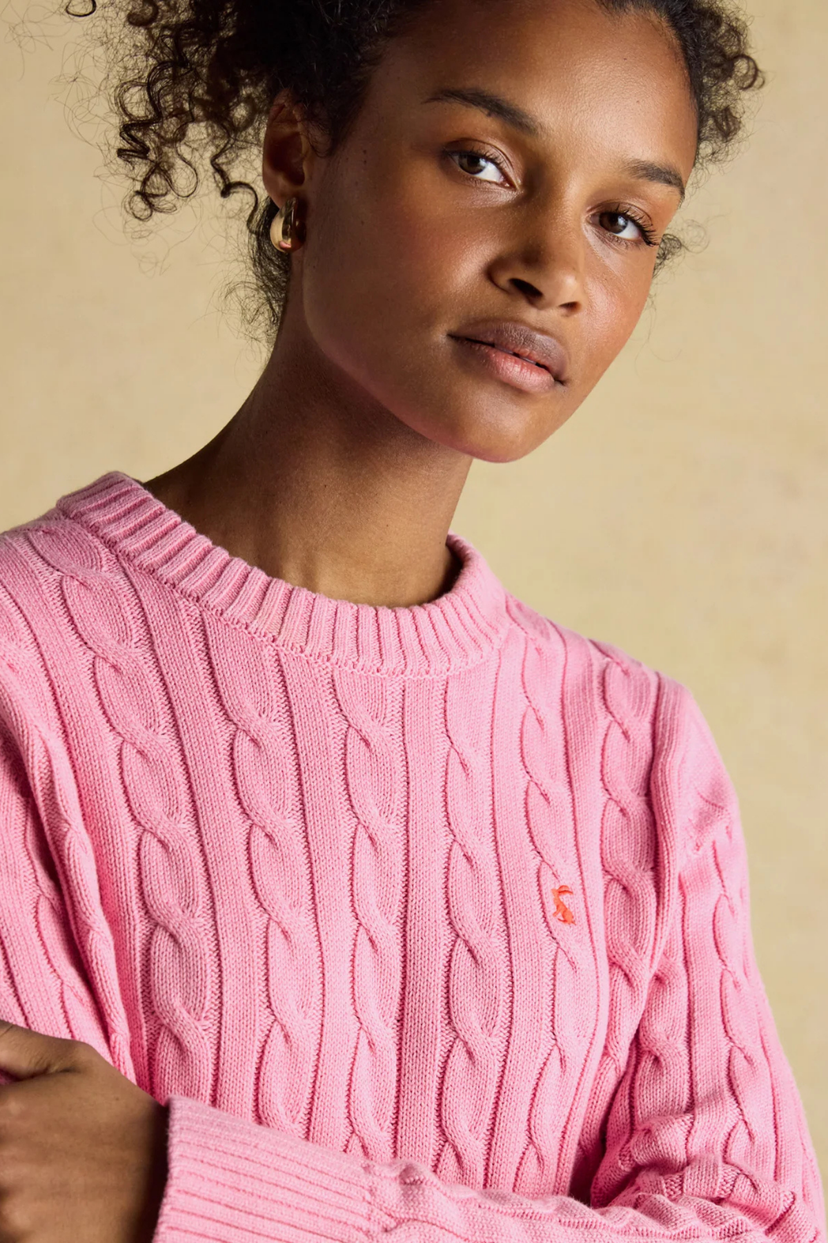 Shop the Joules Classic Cable Jumper in Pink at Dotique. A 100% cotton cable knit with a crew neck, ribbed trims and signature Joules hare embroidery.