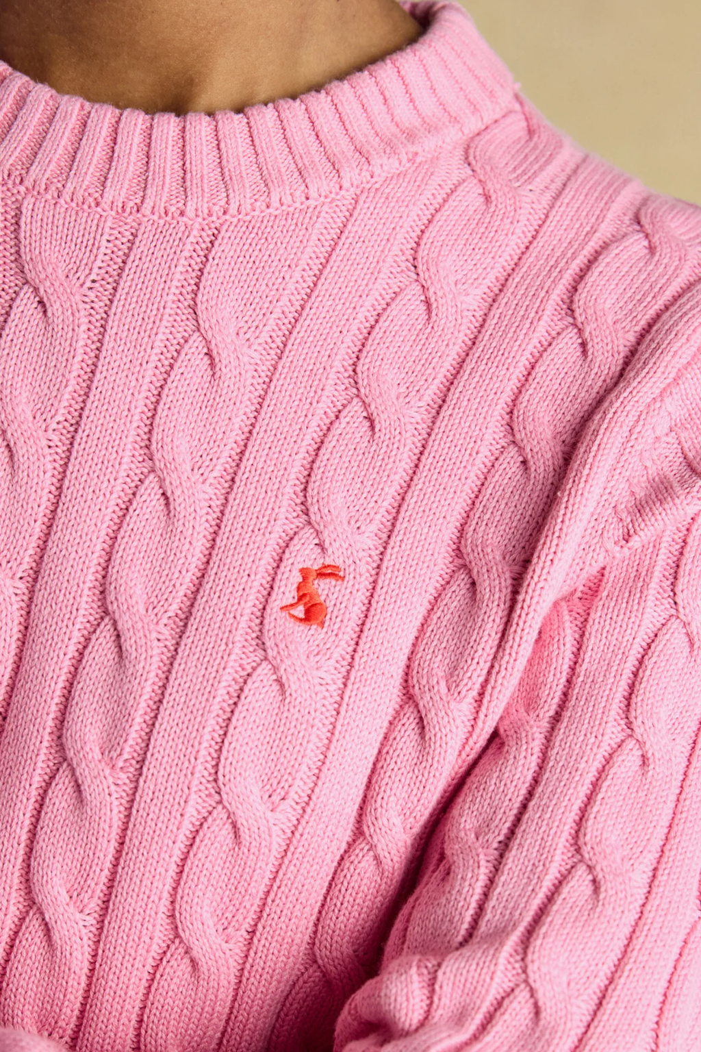 Shop the Joules Classic Cable Jumper in Pink at Dotique. A 100% cotton cable knit with a crew neck, ribbed trims and signature Joules hare embroidery.
