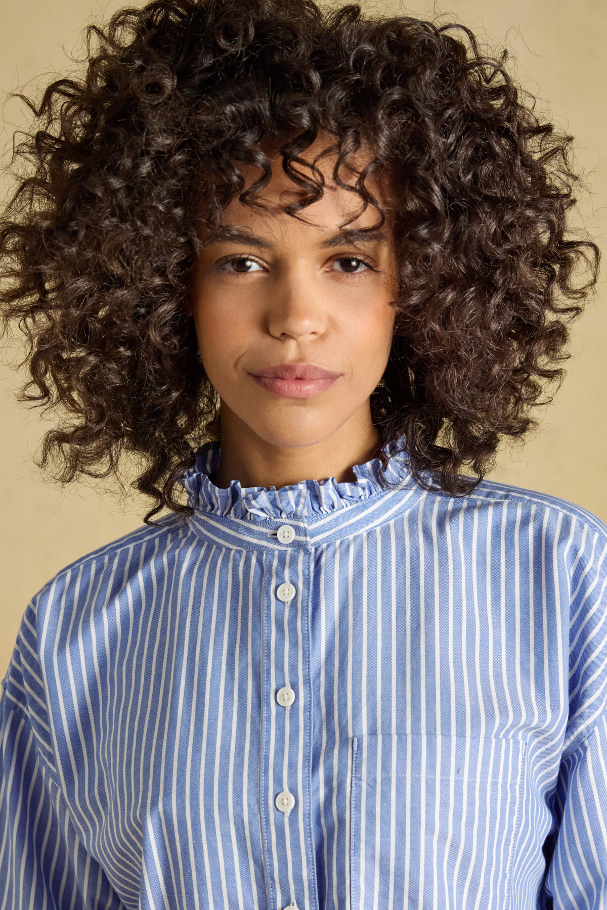 Joules Cropped Oxford Blue Shirt worn by model with striped detail Shop Joules at Dotique