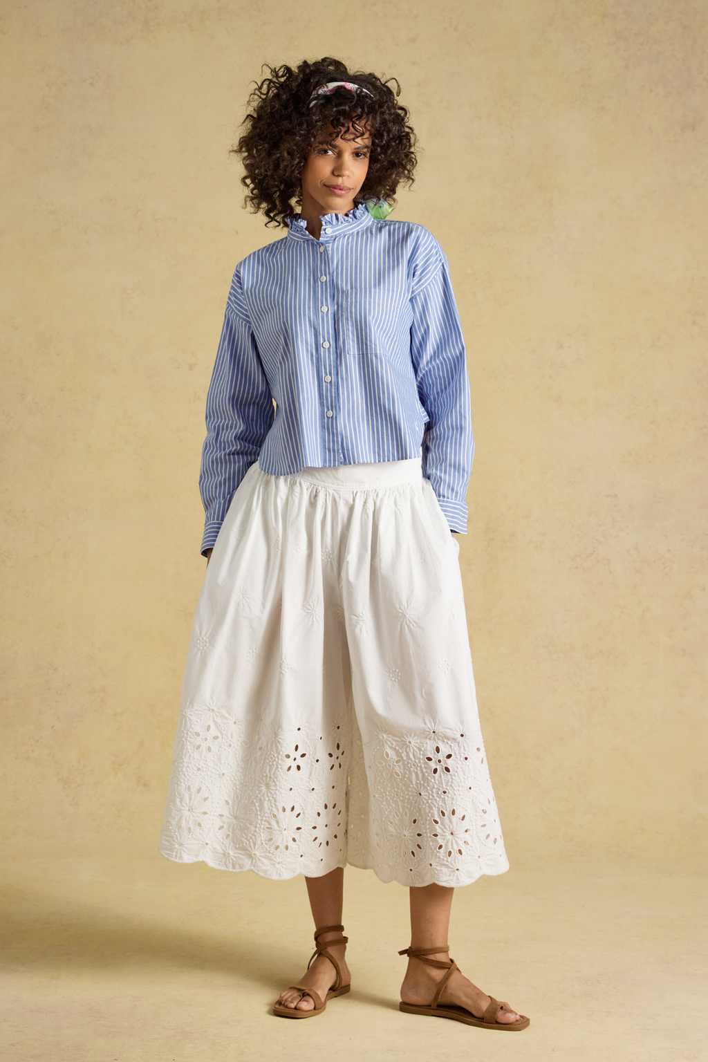 Joules Cropped Oxford Blue Shirt styled with white embroidered skirt on model Shop Joules at Dotique