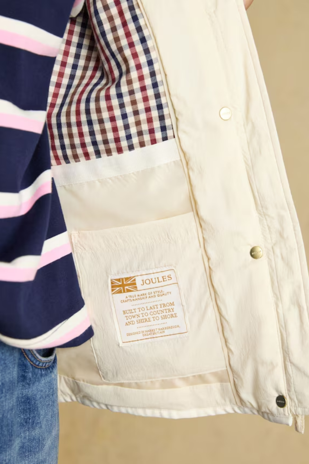 Shop the Joules Highclere showerproof diamond quilted jacket — a stylish and practical layer with cord collar, welt pockets and adjustable waist, perfect for rainy days. Shop Joules at Dotique.