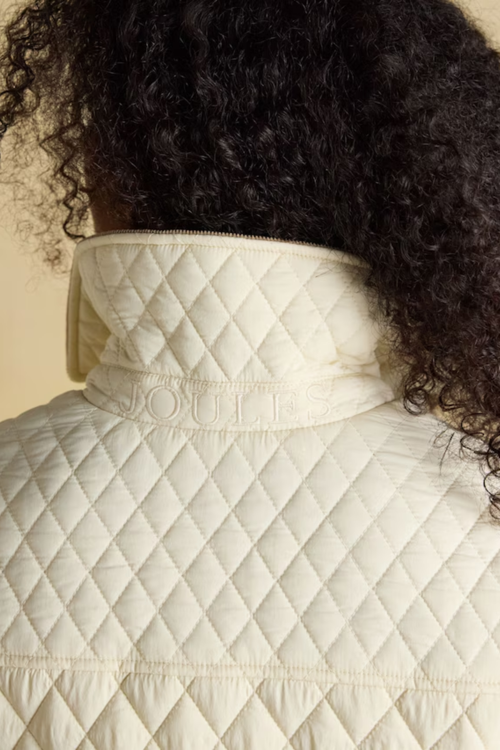 Shop the Joules Highclere showerproof diamond quilted jacket — a stylish and practical layer with cord collar, welt pockets and adjustable waist, perfect for rainy days. Shop Joules at Dotique.